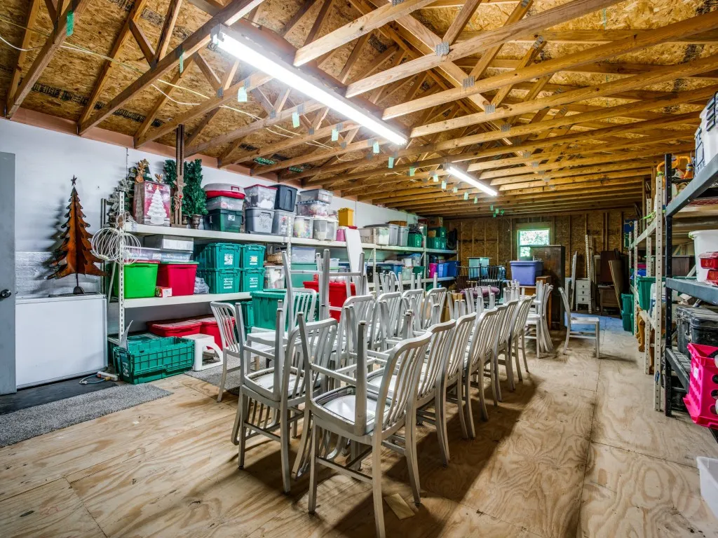 Oversized attached shop includes a huge storage area upstairs with great storage features