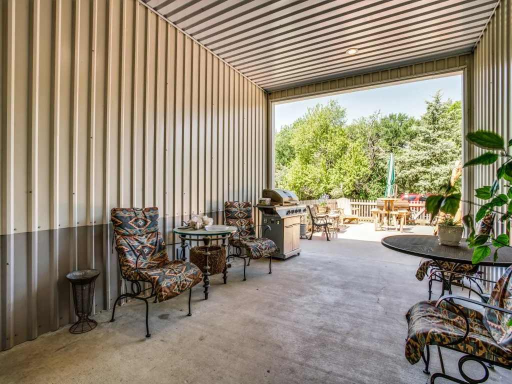 Breezeway with sitting area between main house and shop
