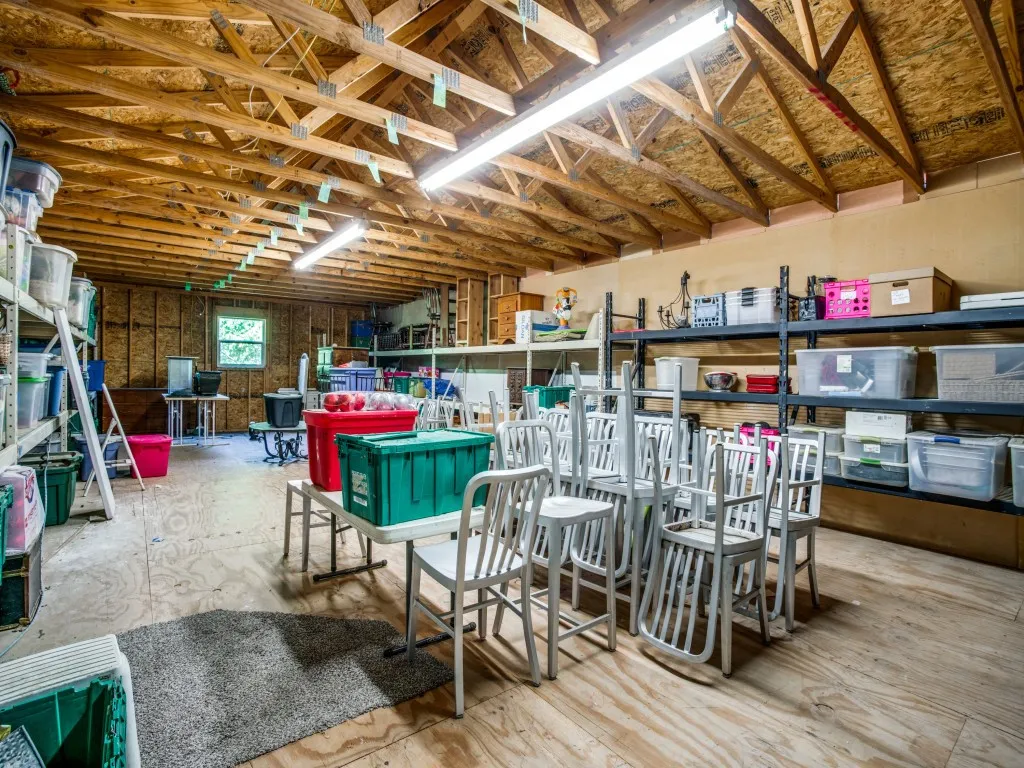 Oversized attached shop includes a huge storage area upstairs with great storage features