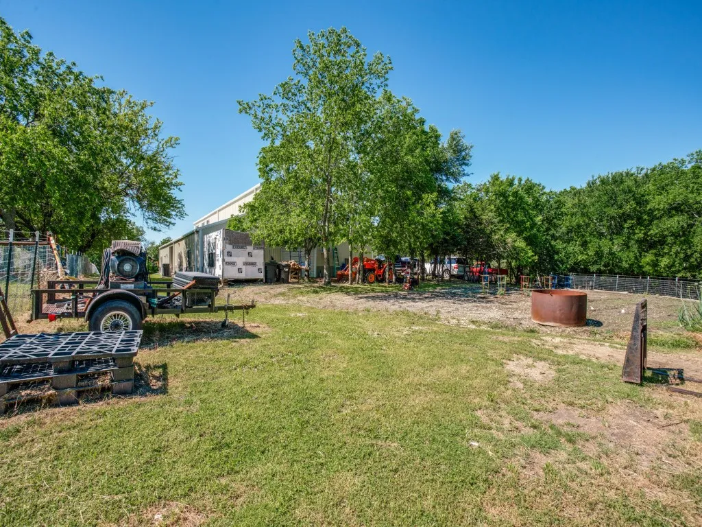 Oversized attached shop includes a huge storage area upstairs with great storage features