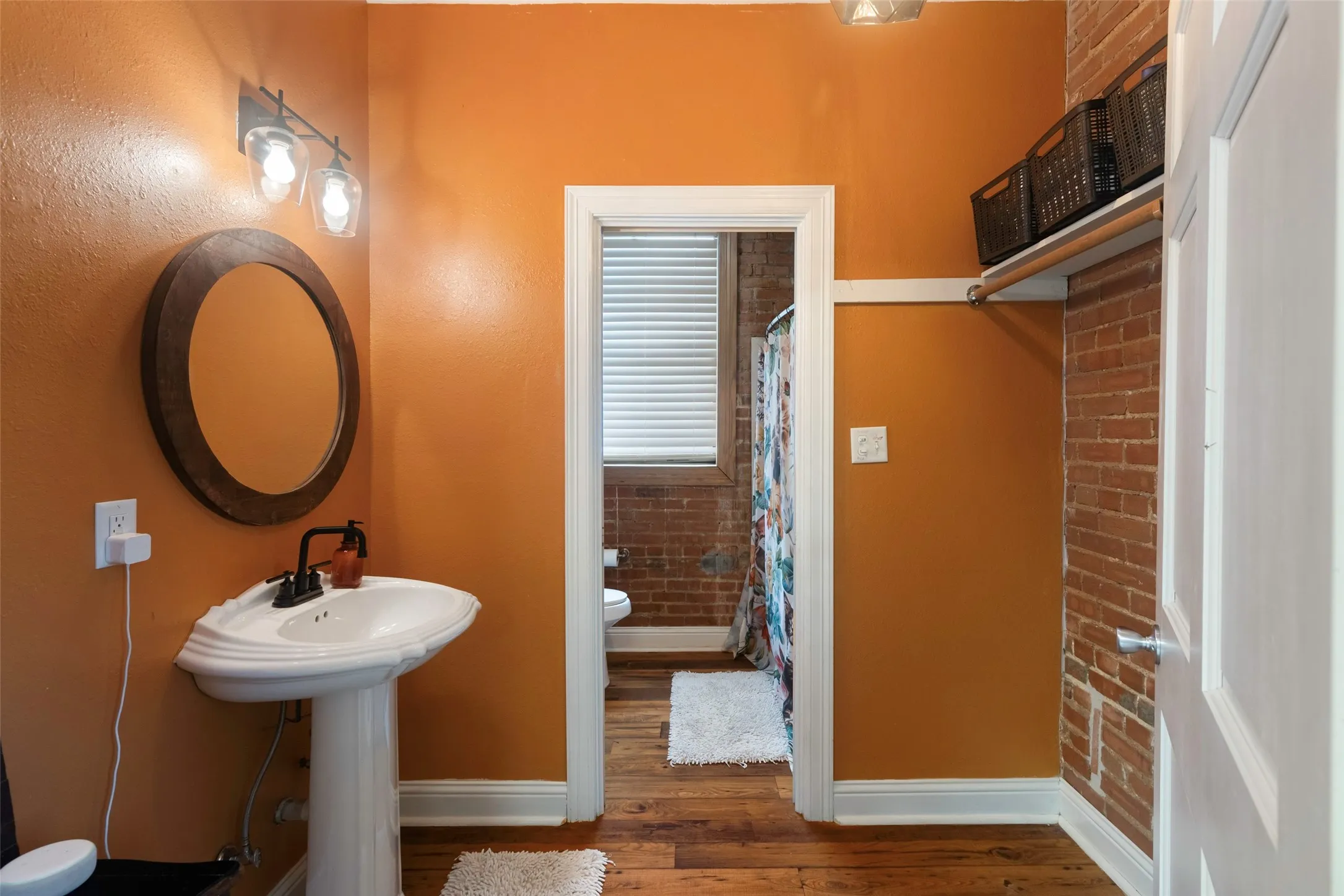 Bathroom with wood-type flooring and toilet