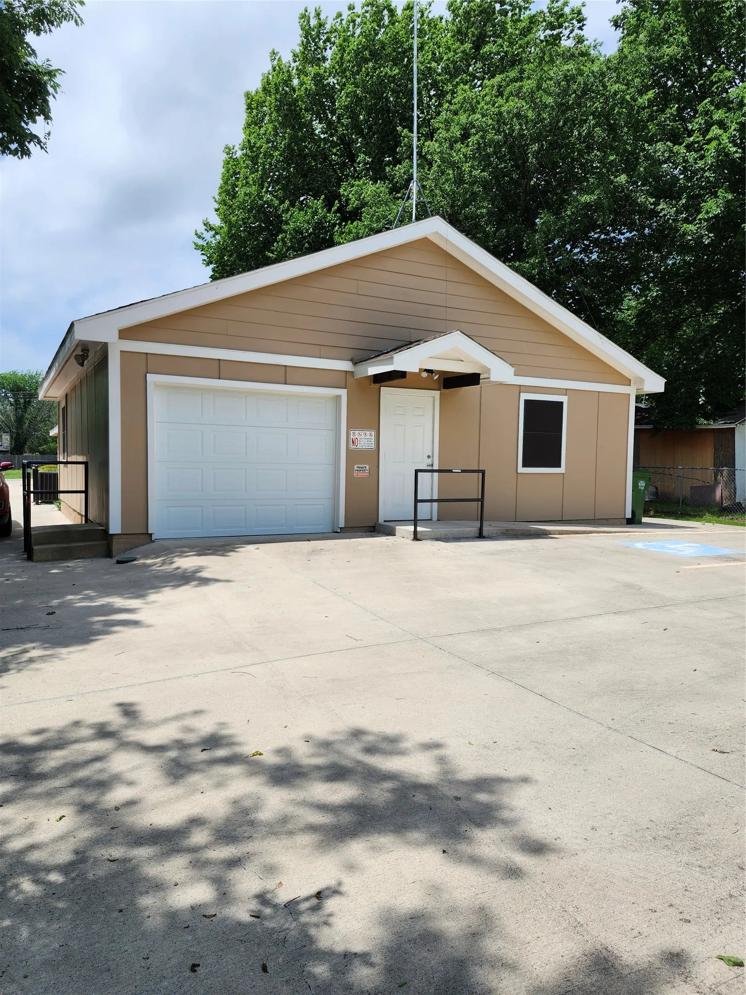 Rear entry off Avenue A
Sngle car garage with handicap parking in this parking area.