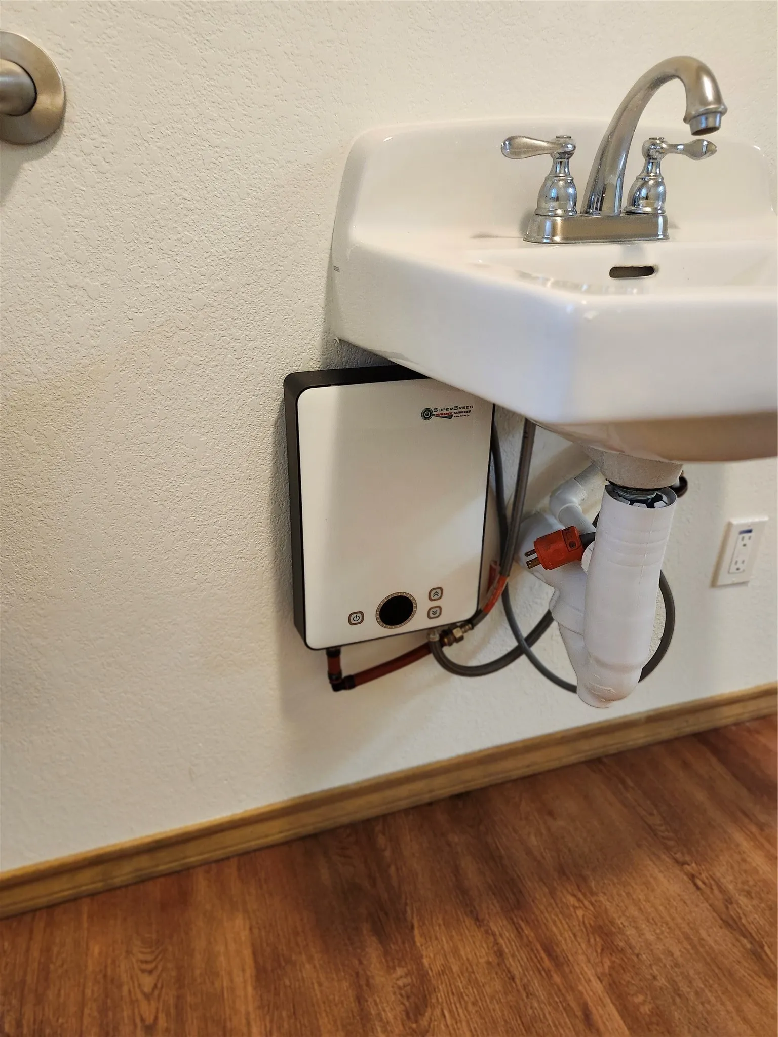 One of the 2 bathrooms is equipped with a small electric water heater.
