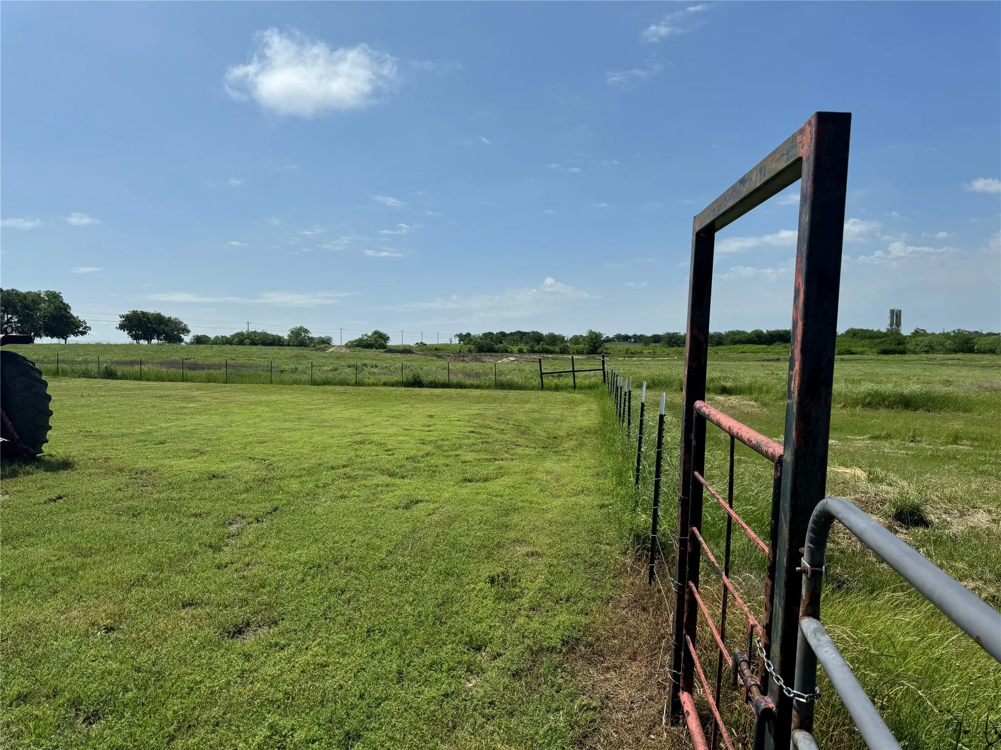 View of yard with a rural view