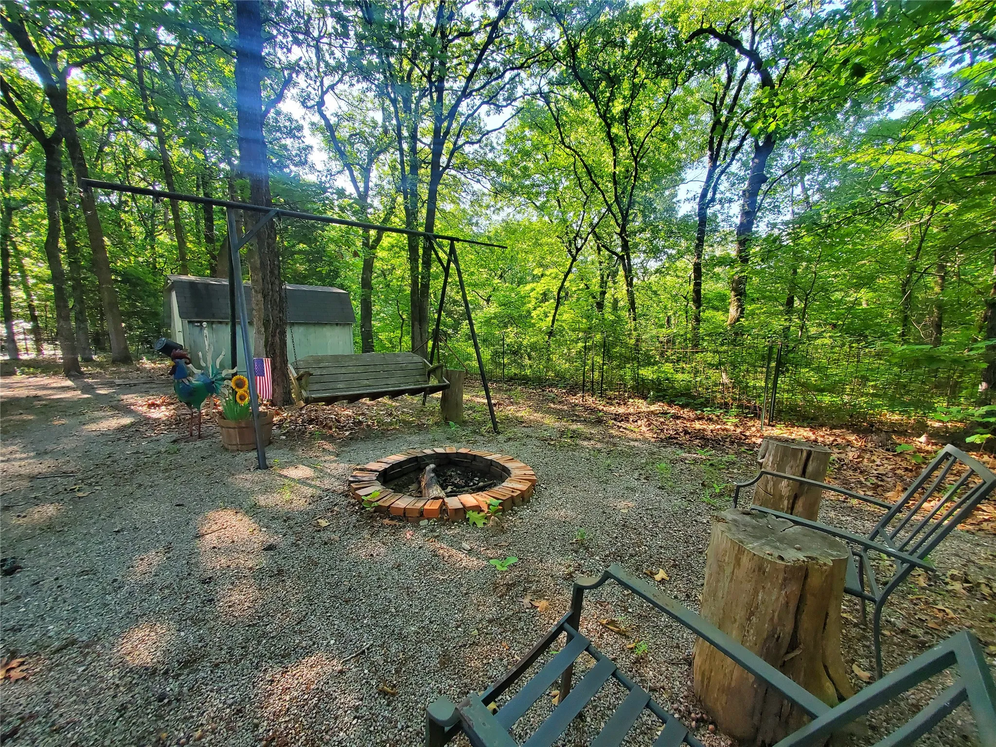 View of yard featuring a fire pit and an outdoor structure