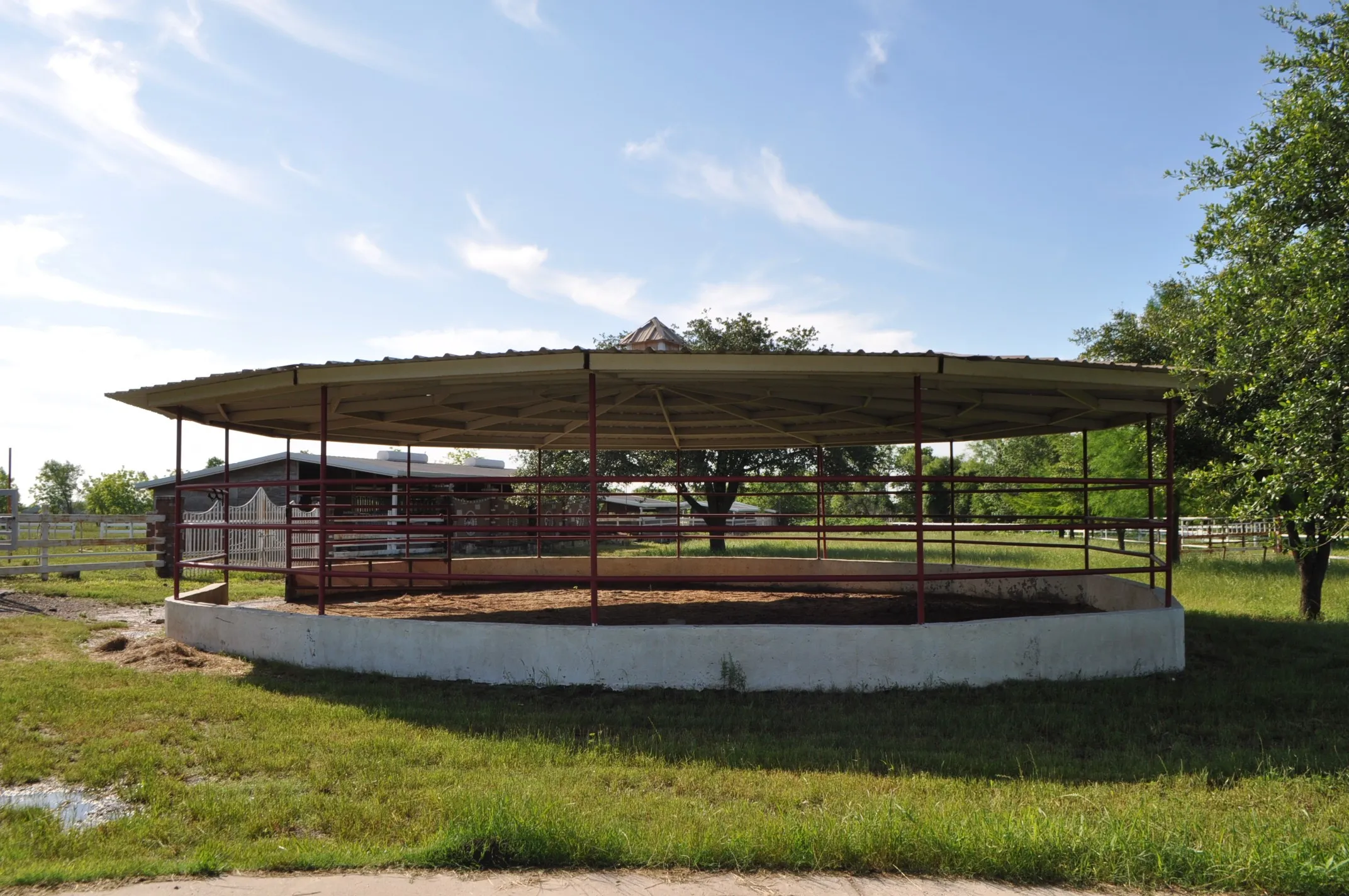 View of property's community with an outdoor structure and a lawn