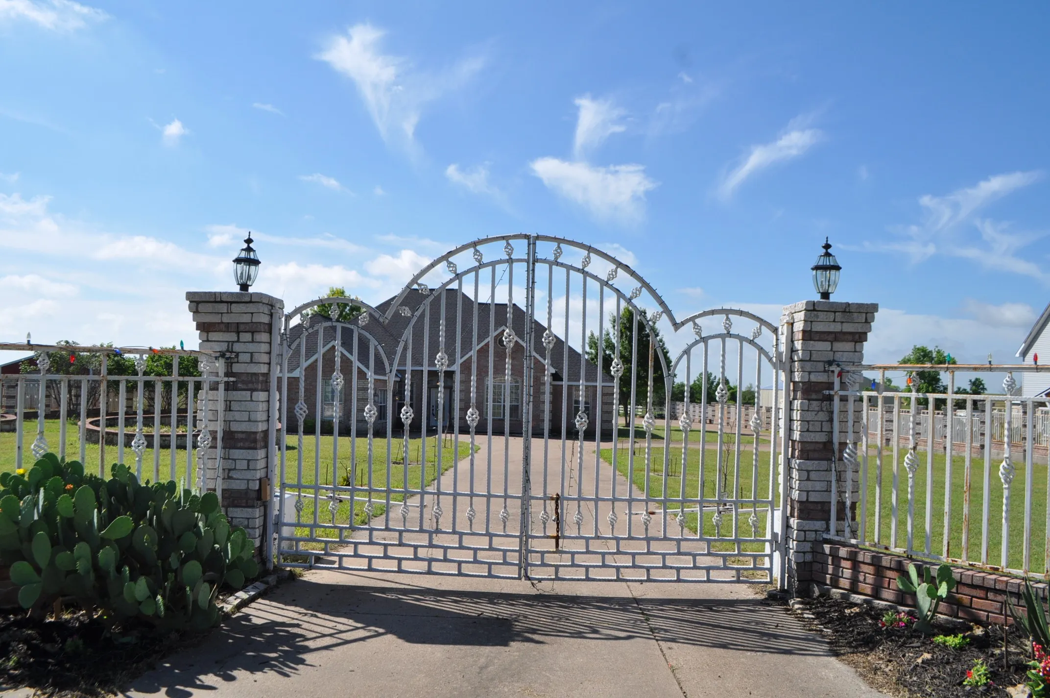 View of gate featuring a yard
