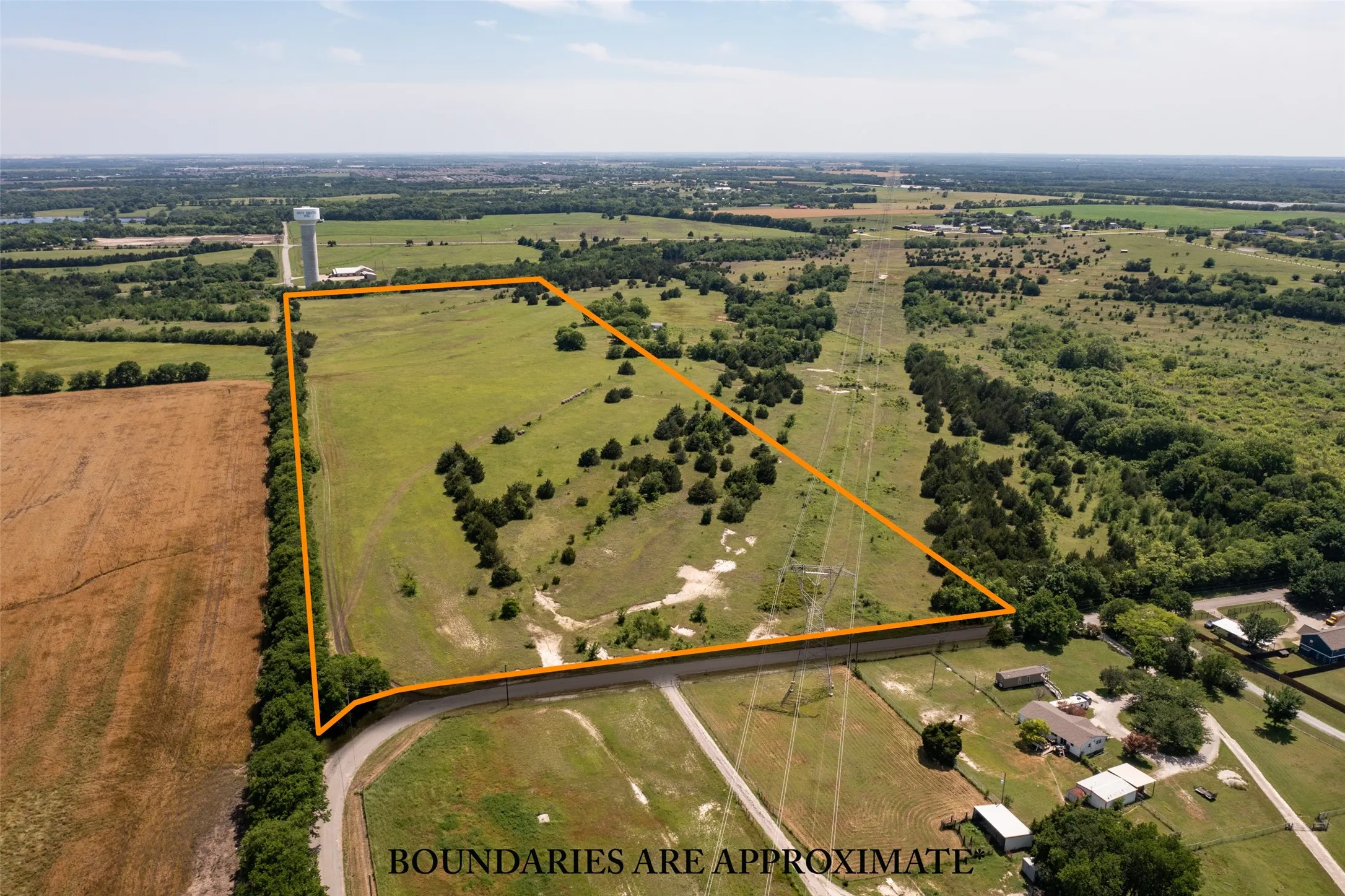 Birds eye view of property with a rural view