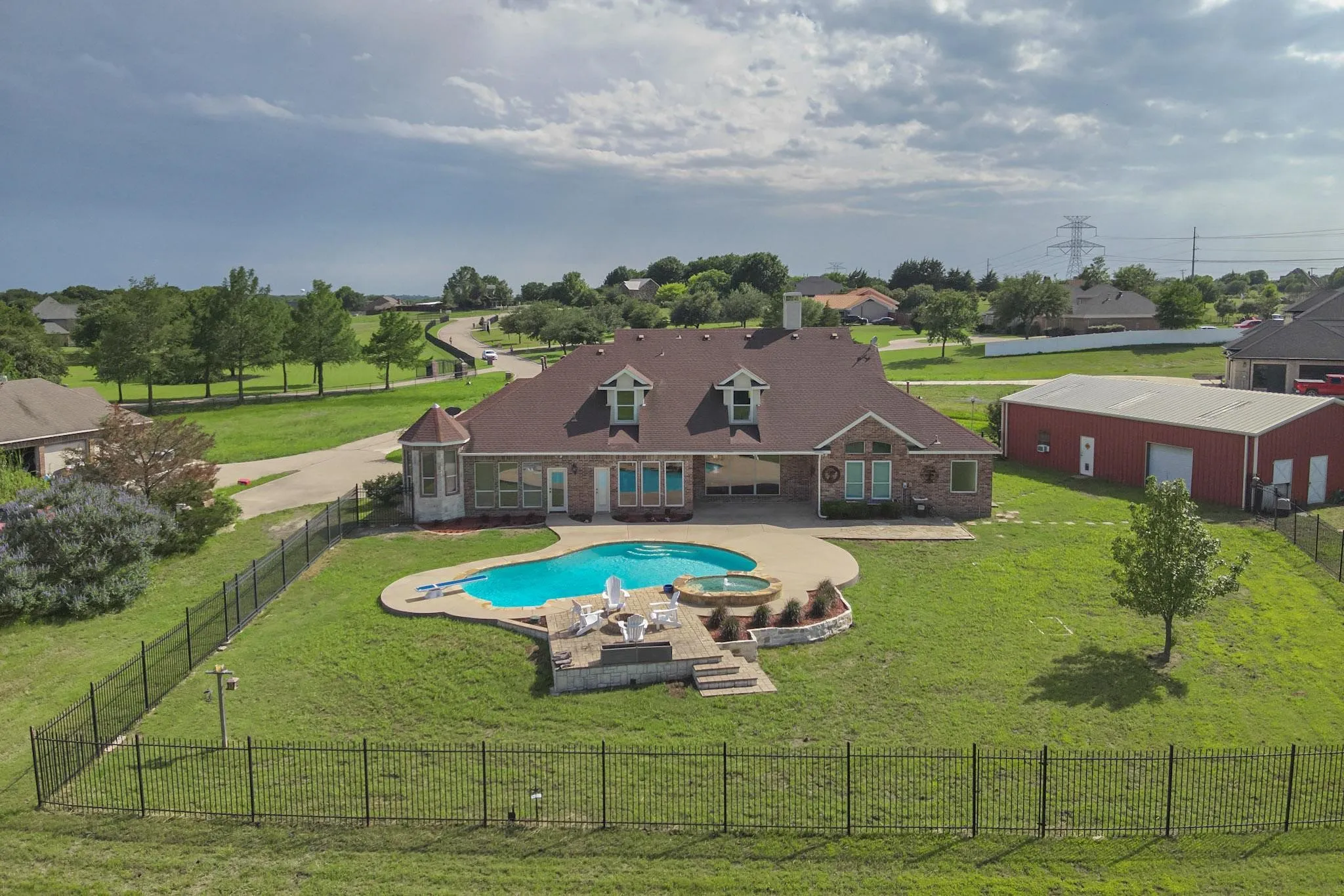 View of swimming pool featuring an outbuilding, a yard, and a patio area