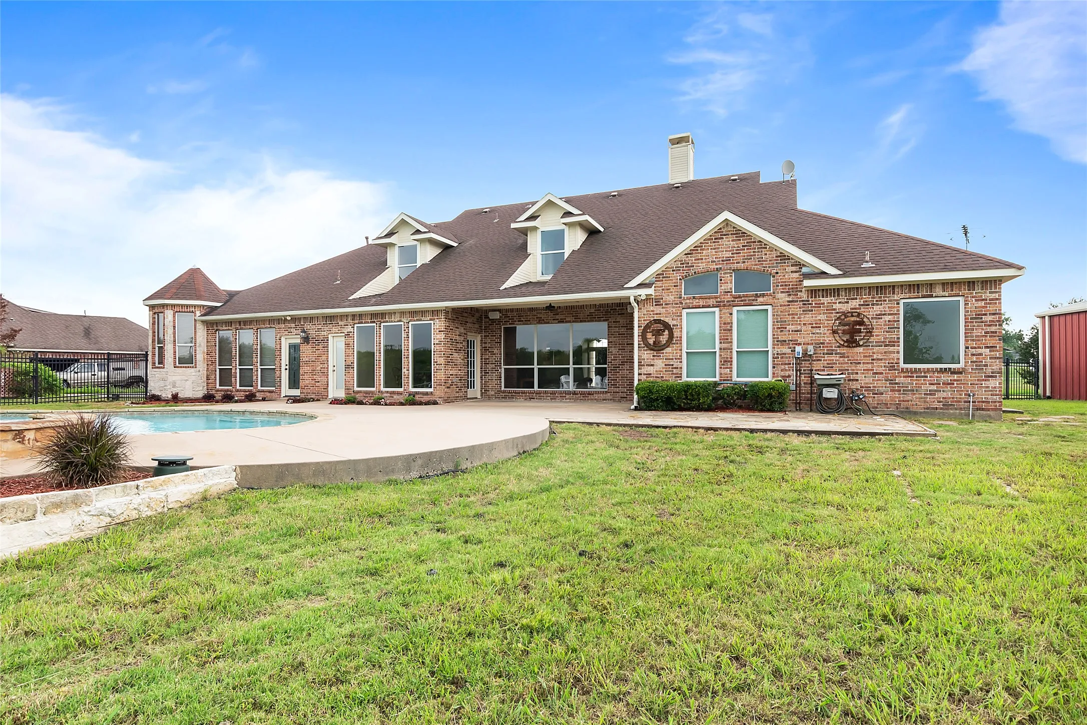 Rear view of house with a patio and a yard