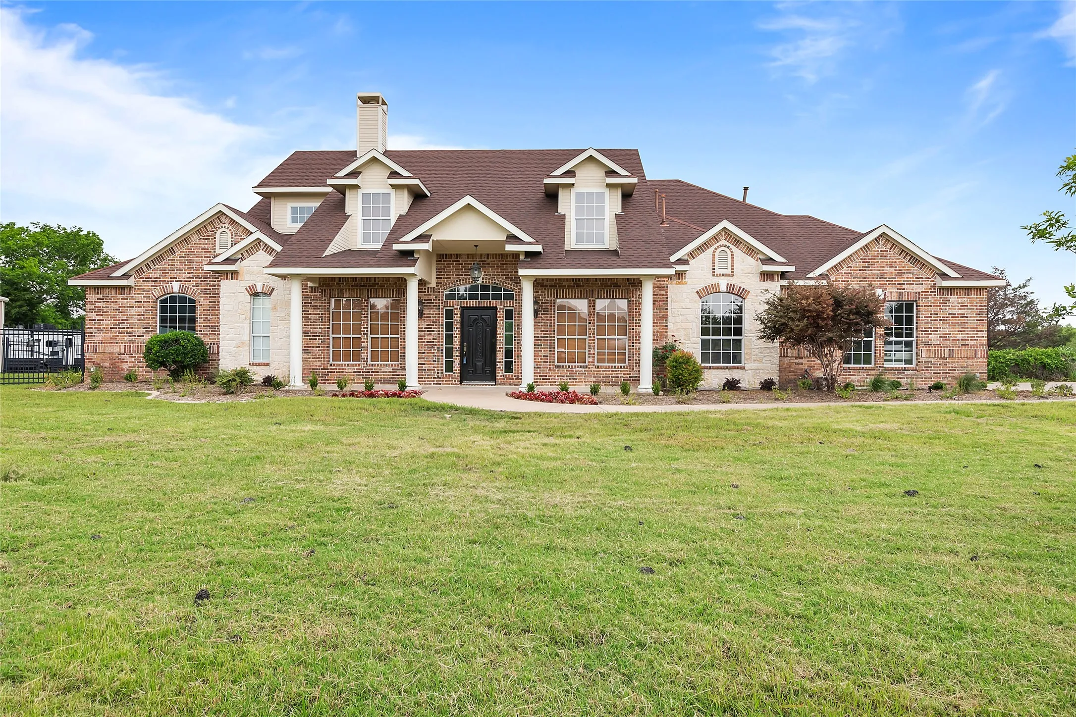 View of front of property with a front yard