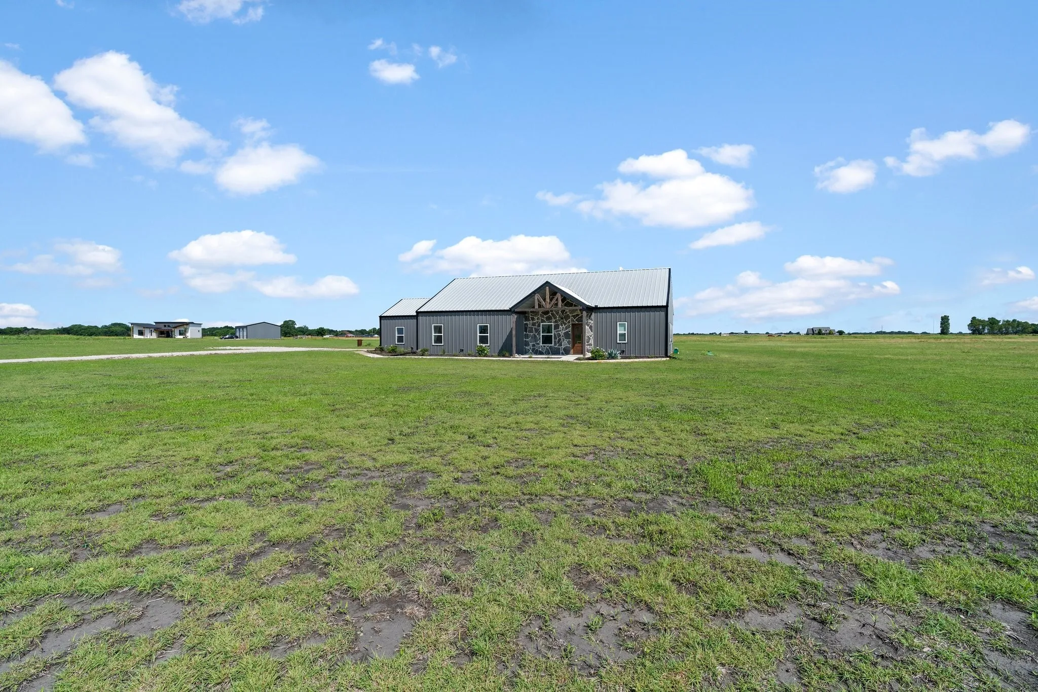 View of yard featuring an outdoor structure and a rural view