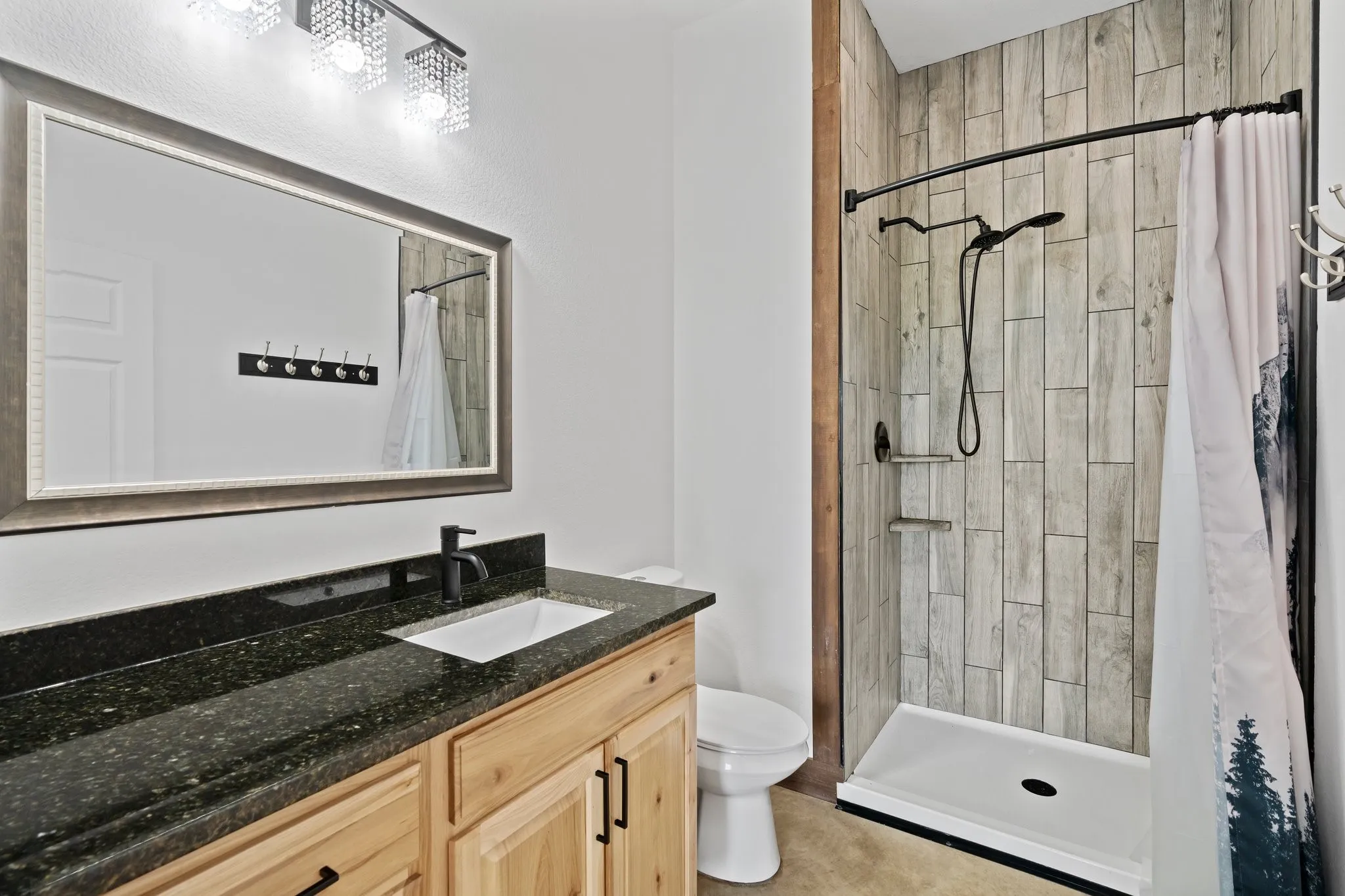 Bathroom featuring tile floors, toilet, a shower with shower curtain, and large vanity