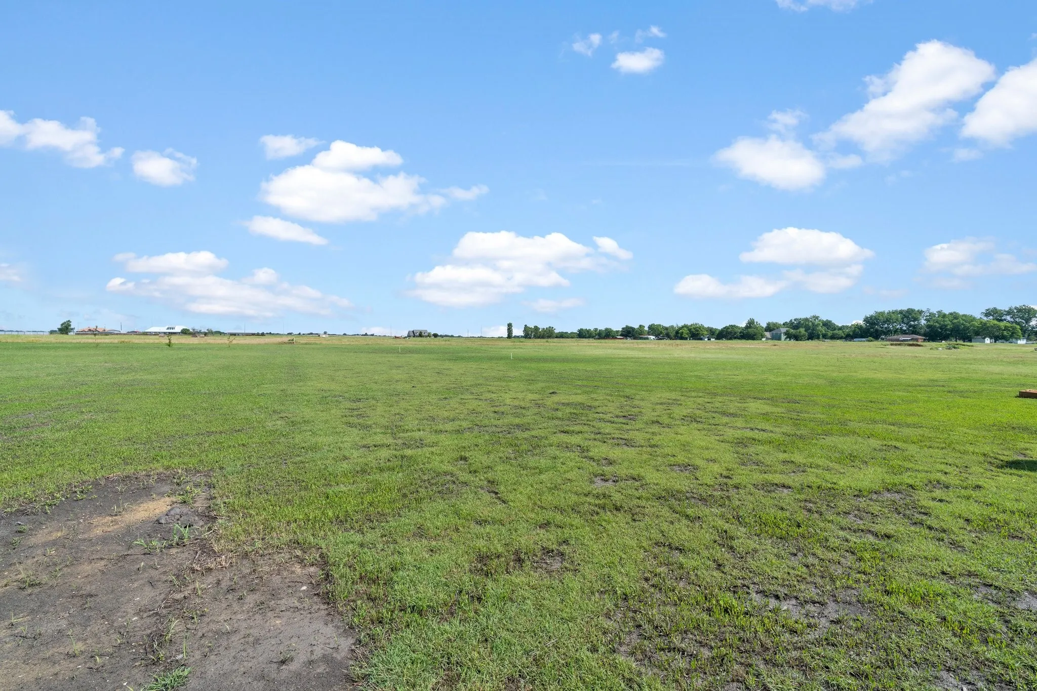 View of yard with a rural view