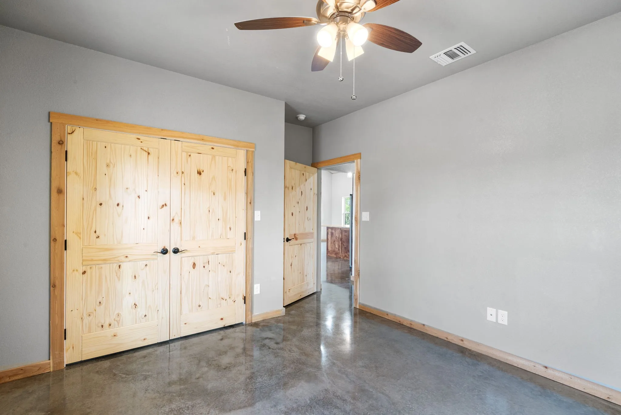 Unfurnished bedroom with ceiling fan
