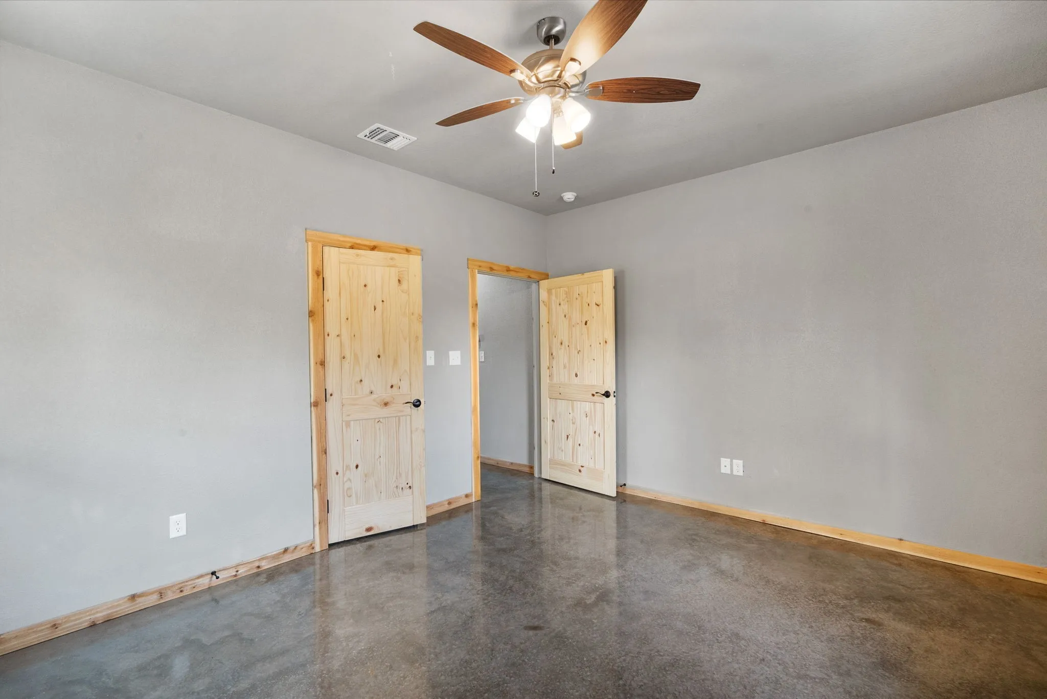 Spare room with ceiling fan