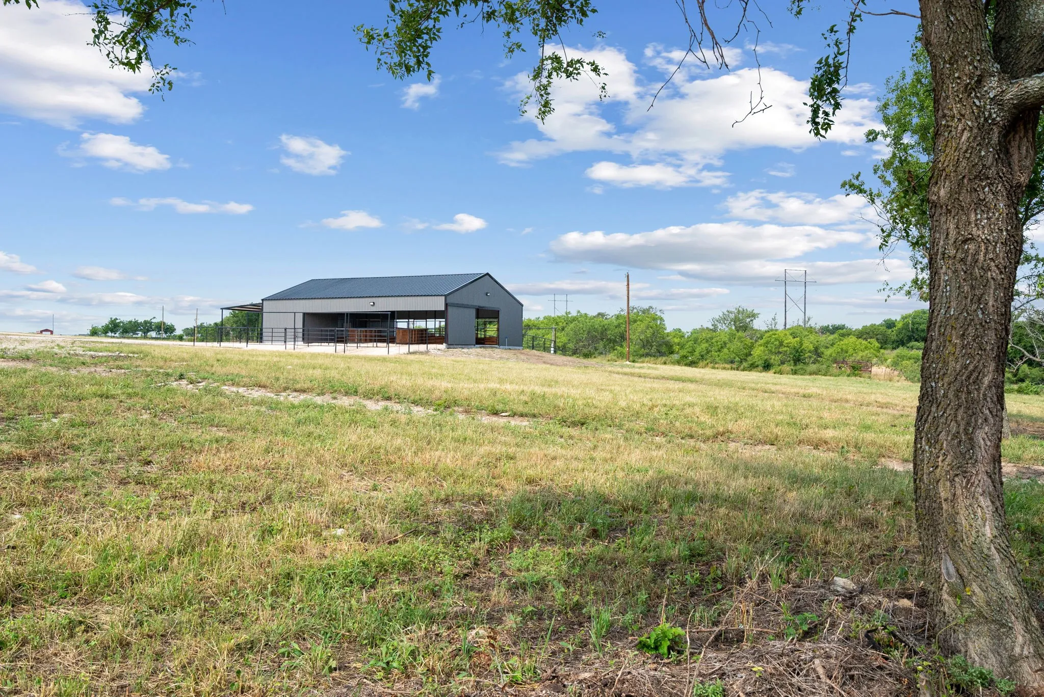 View of yard with a rural view and an outdoor structure