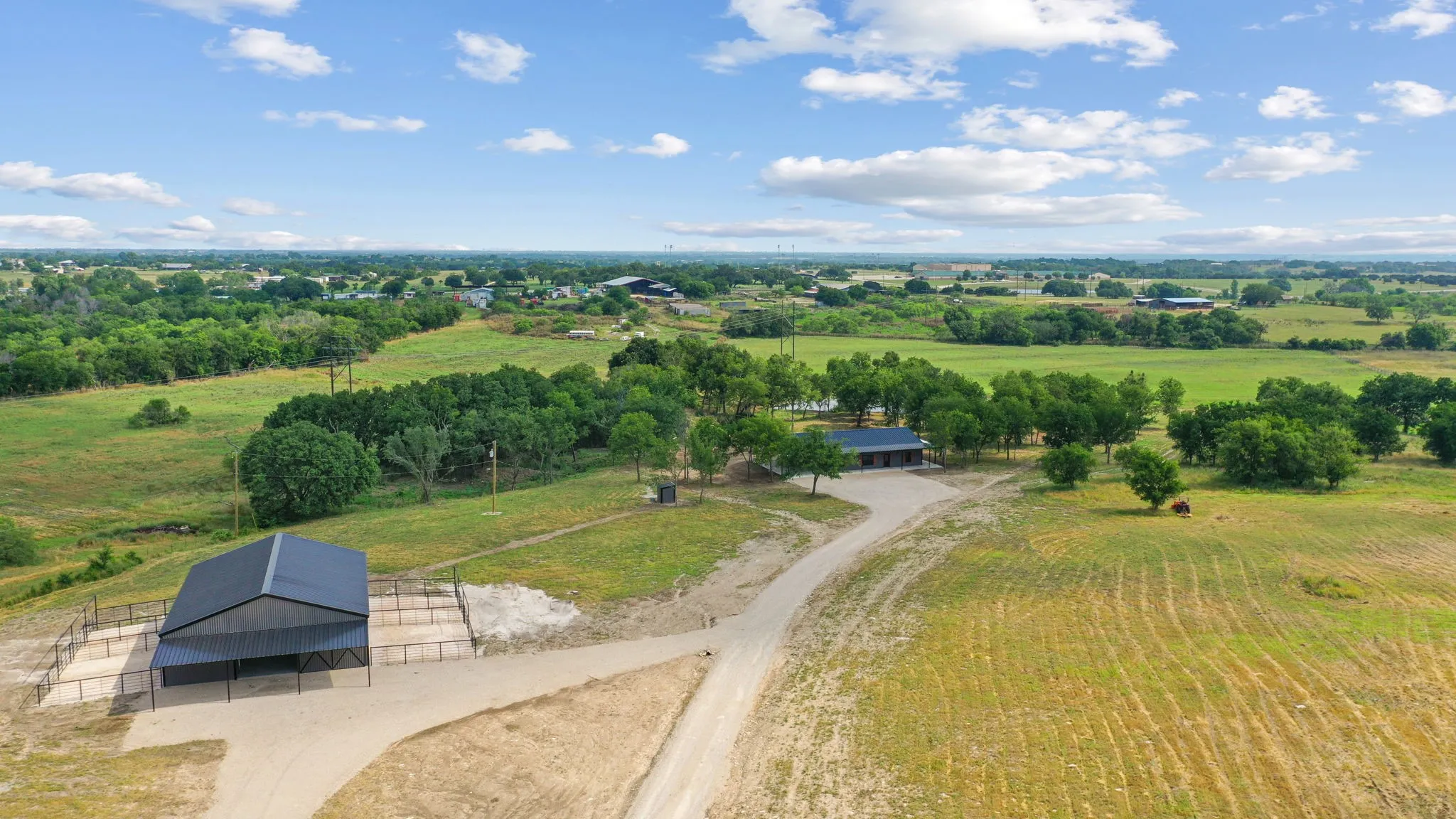Birds eye view of property featuring a rural view