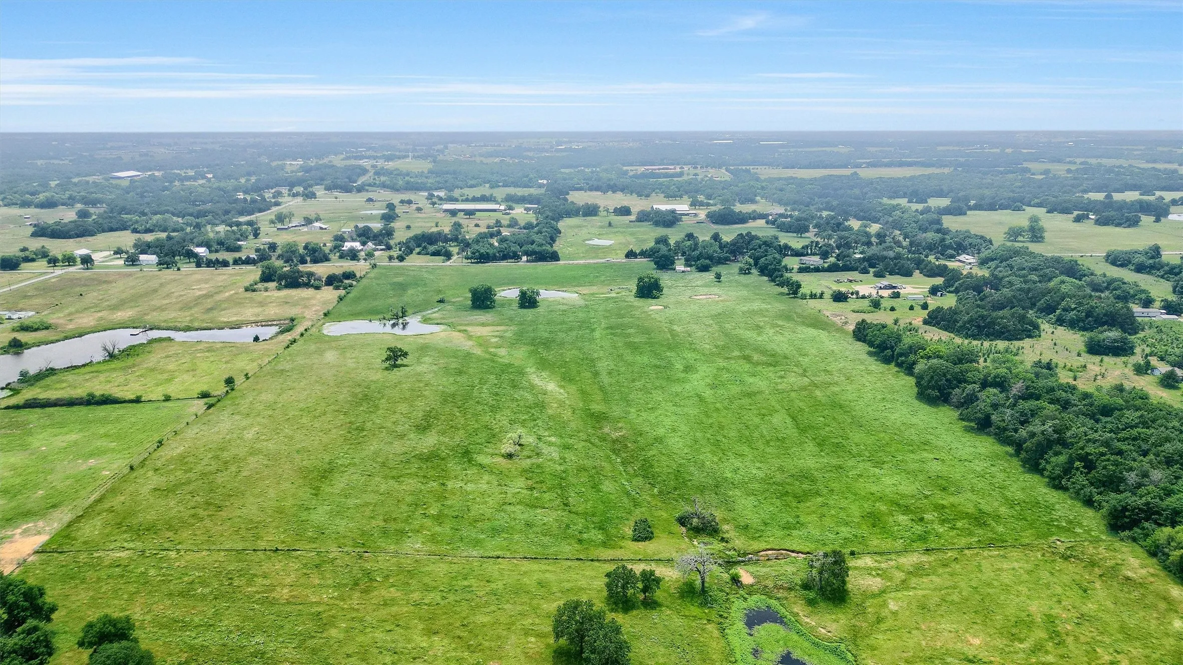 Birds eye view of property with a rural view