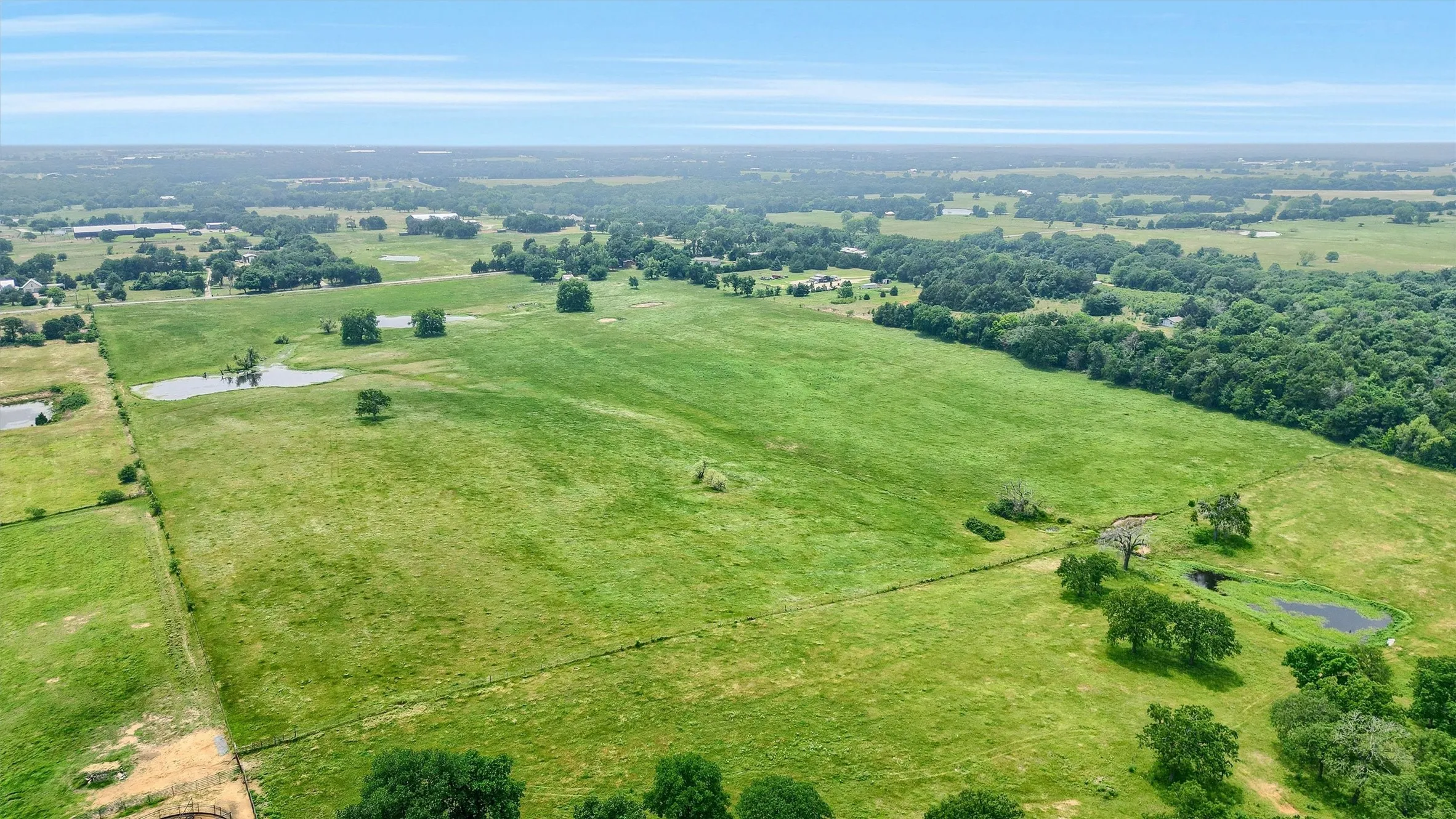 Birds eye view of property with a rural view