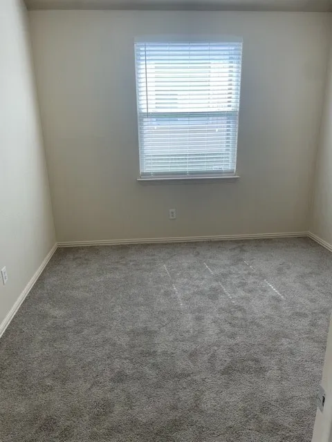 Unfurnished room featuring carpet floors