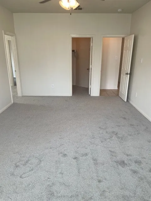 Unfurnished bedroom featuring a closet and carpet