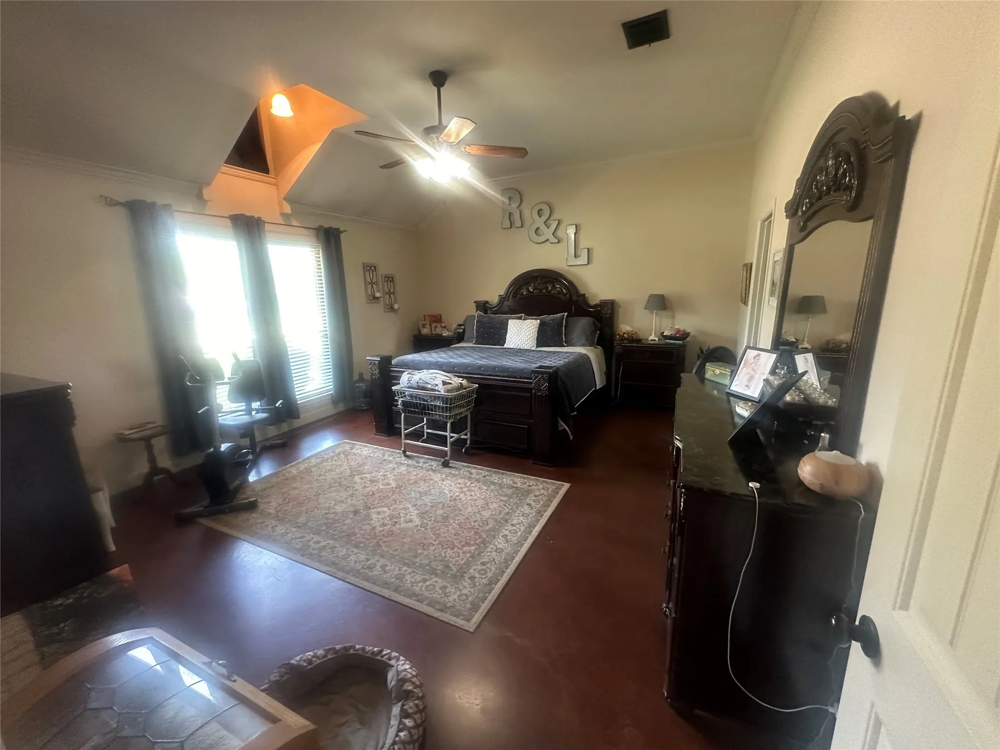 Bedroom featuring ceiling fan and crown molding