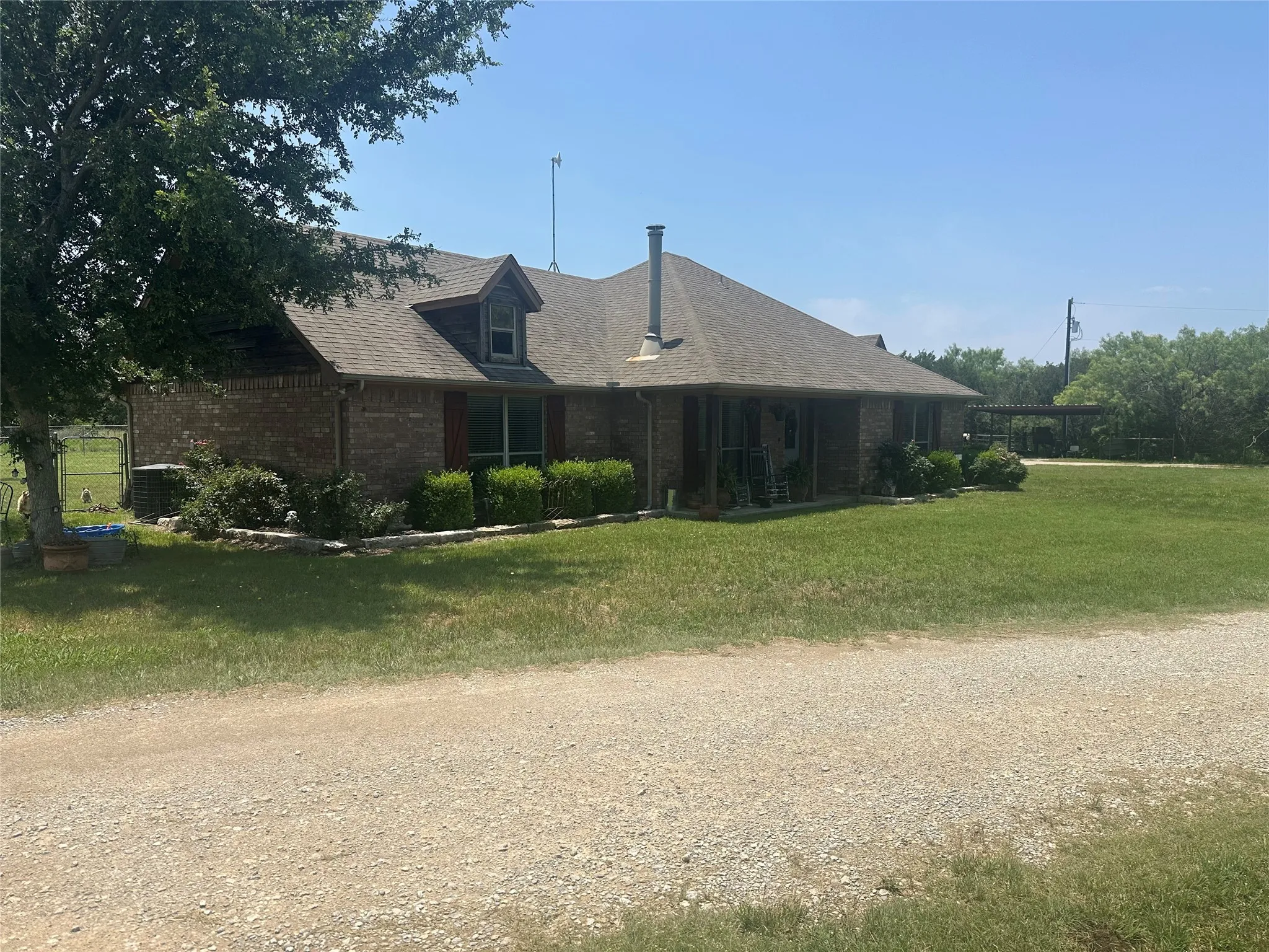 View of side of home with a lawn