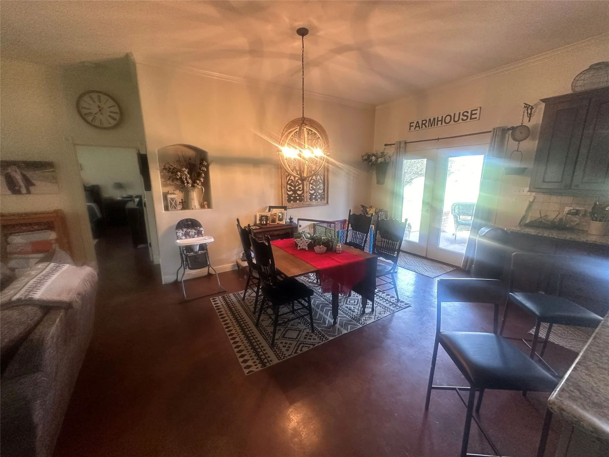 Dining space featuring an inviting chandelier and crown molding