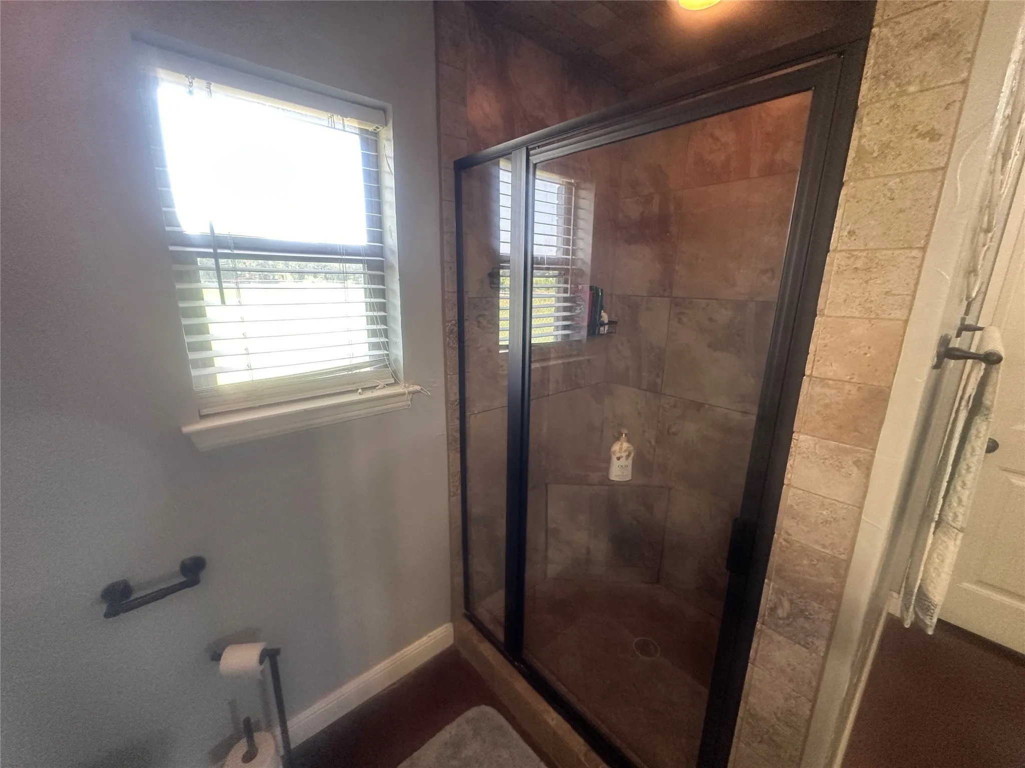 Bathroom with a shower with door
