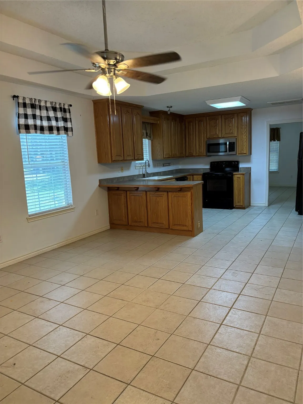 looking in from entry living area to kitchen