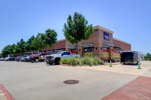 View of vehicle parking and Earnest B's BBQ