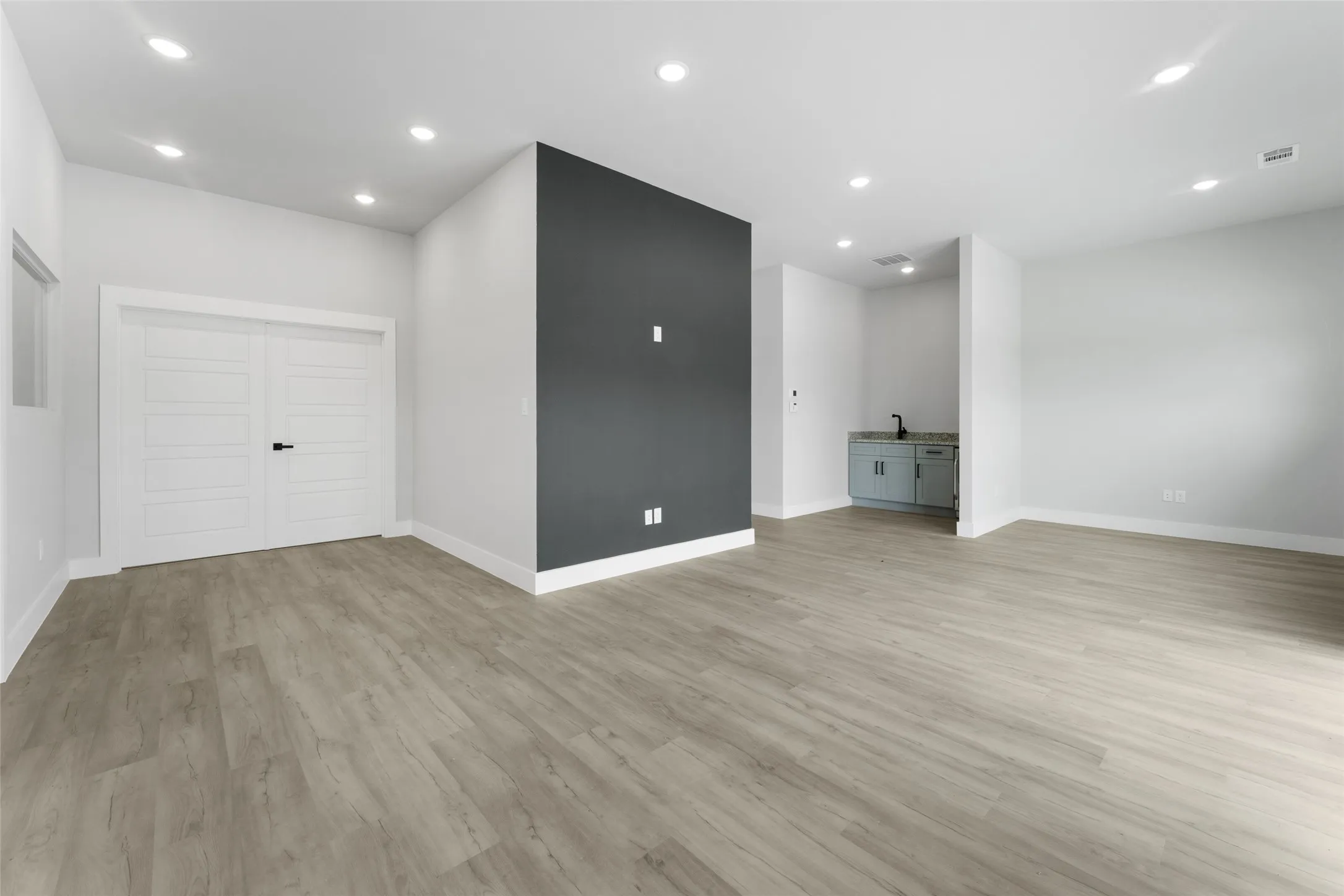 Unfurnished living room featuring light wood-type flooring