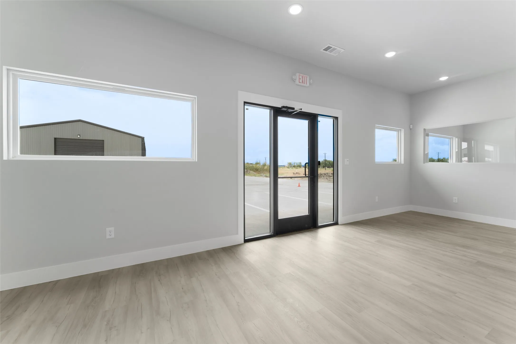Empty room with light wood-type flooring