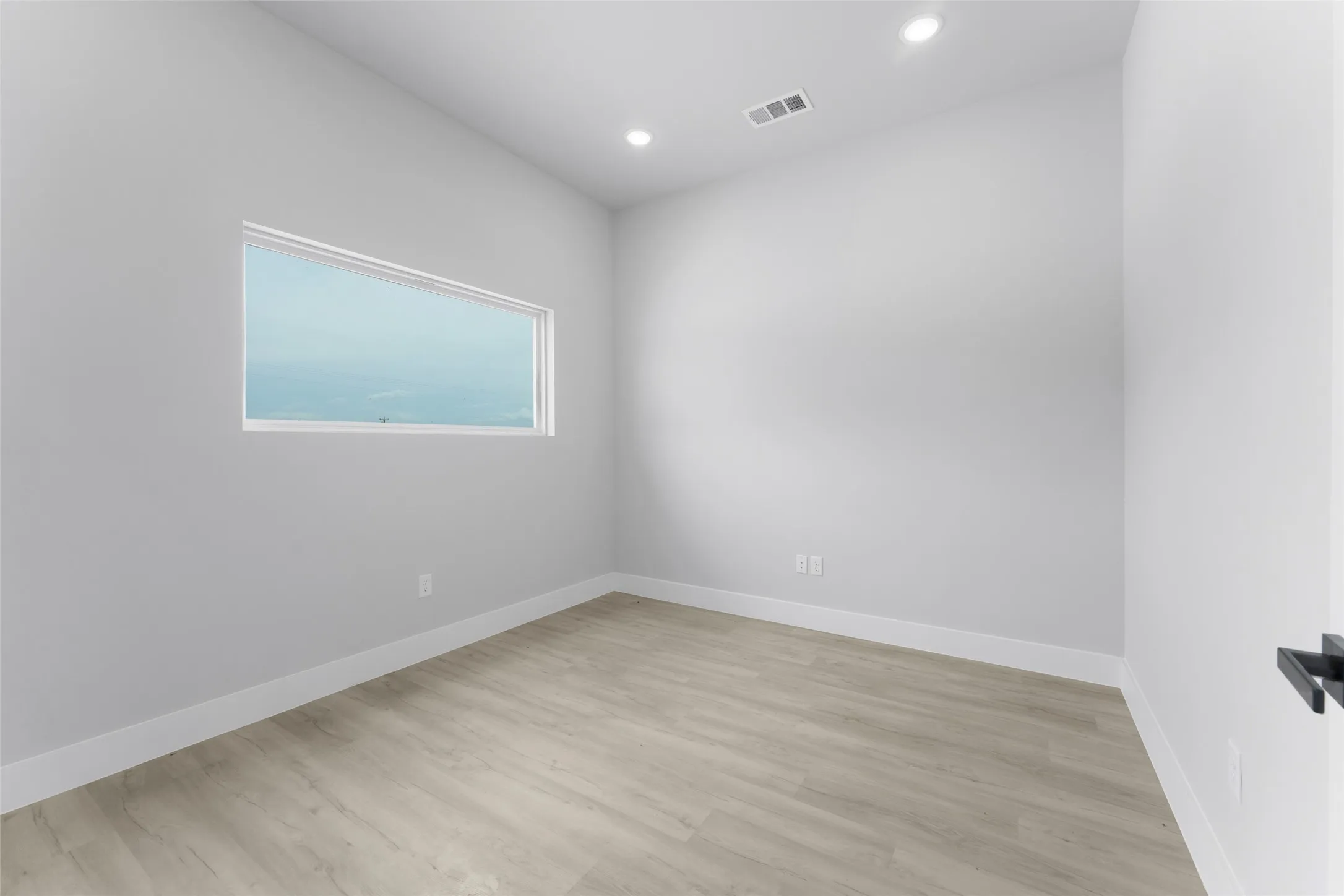 Empty room featuring light hardwood / wood-style flooring