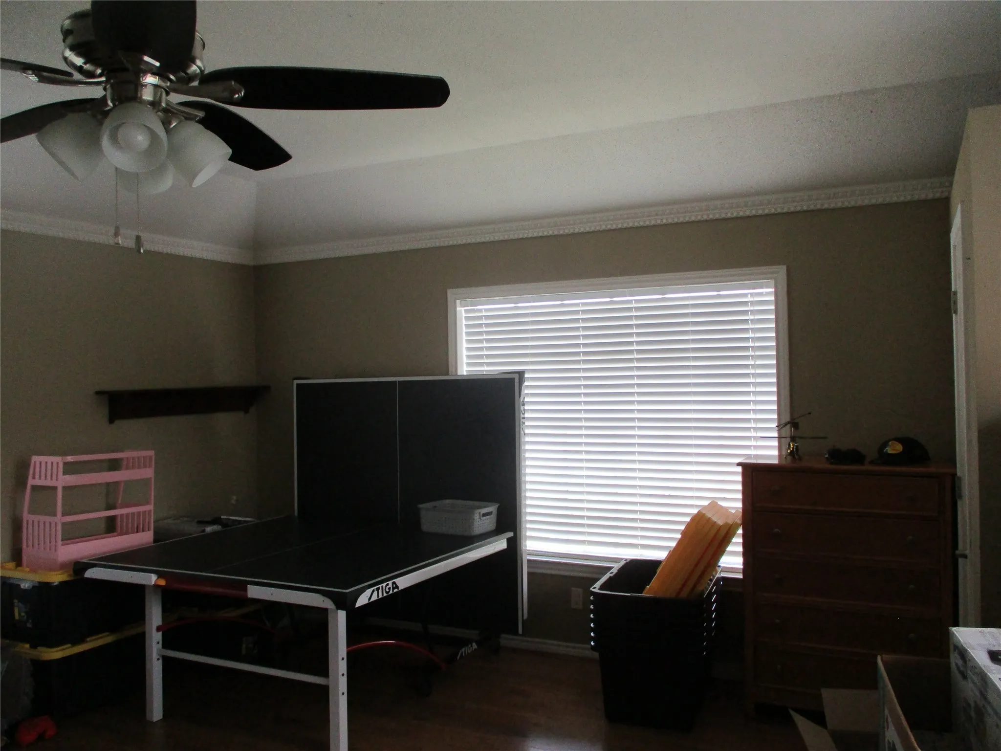 Home office featuring ornamental molding, ceiling fan, lofted ceiling, and hardwood / wood-style floors