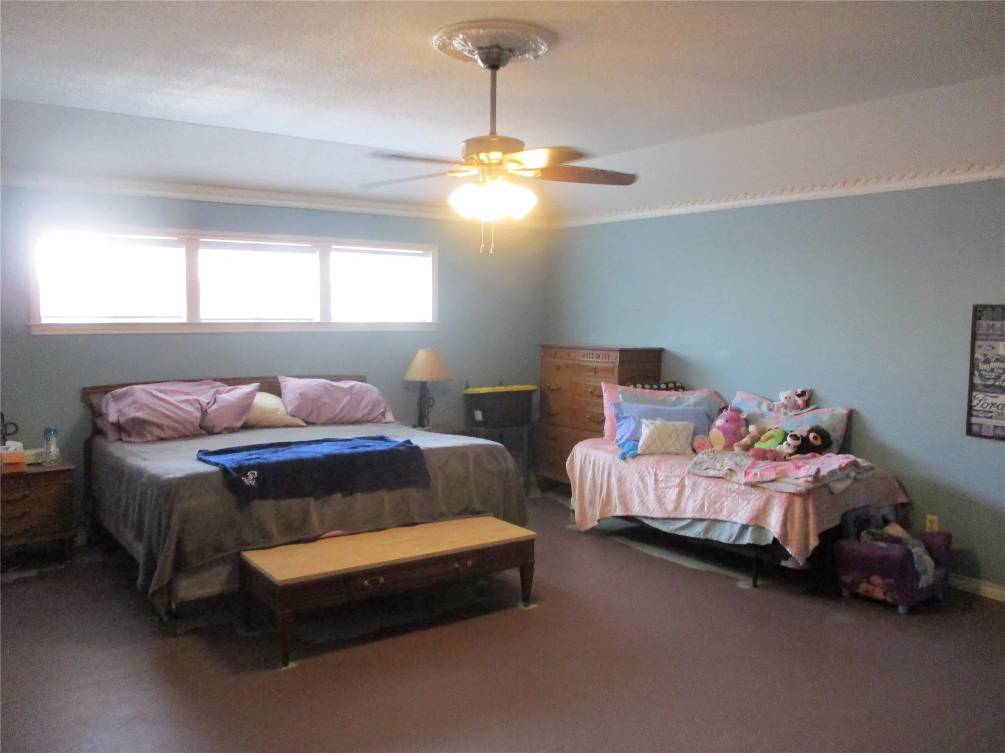 Bedroom with carpet and ceiling fan