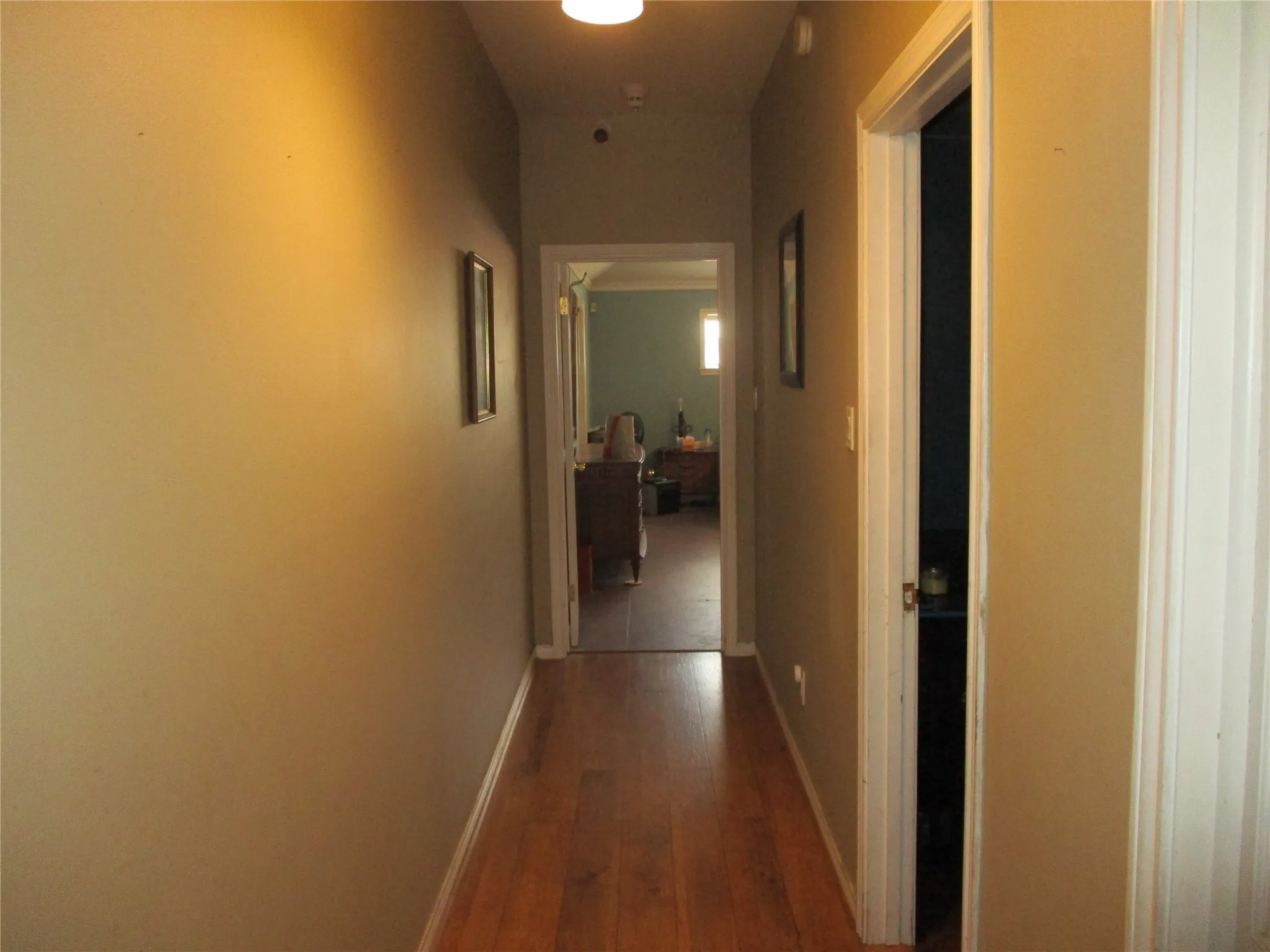 Hallway with wood-type flooring