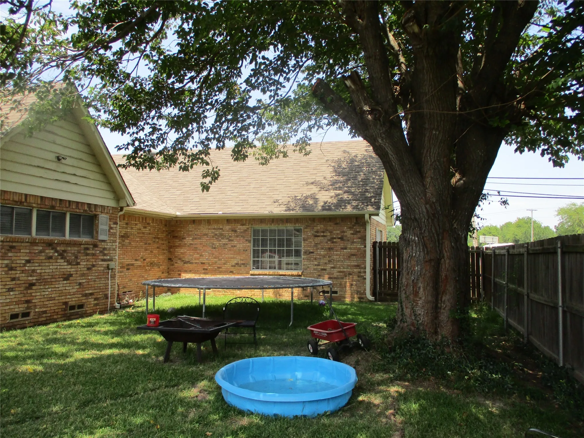 View of yard featuring a trampoline