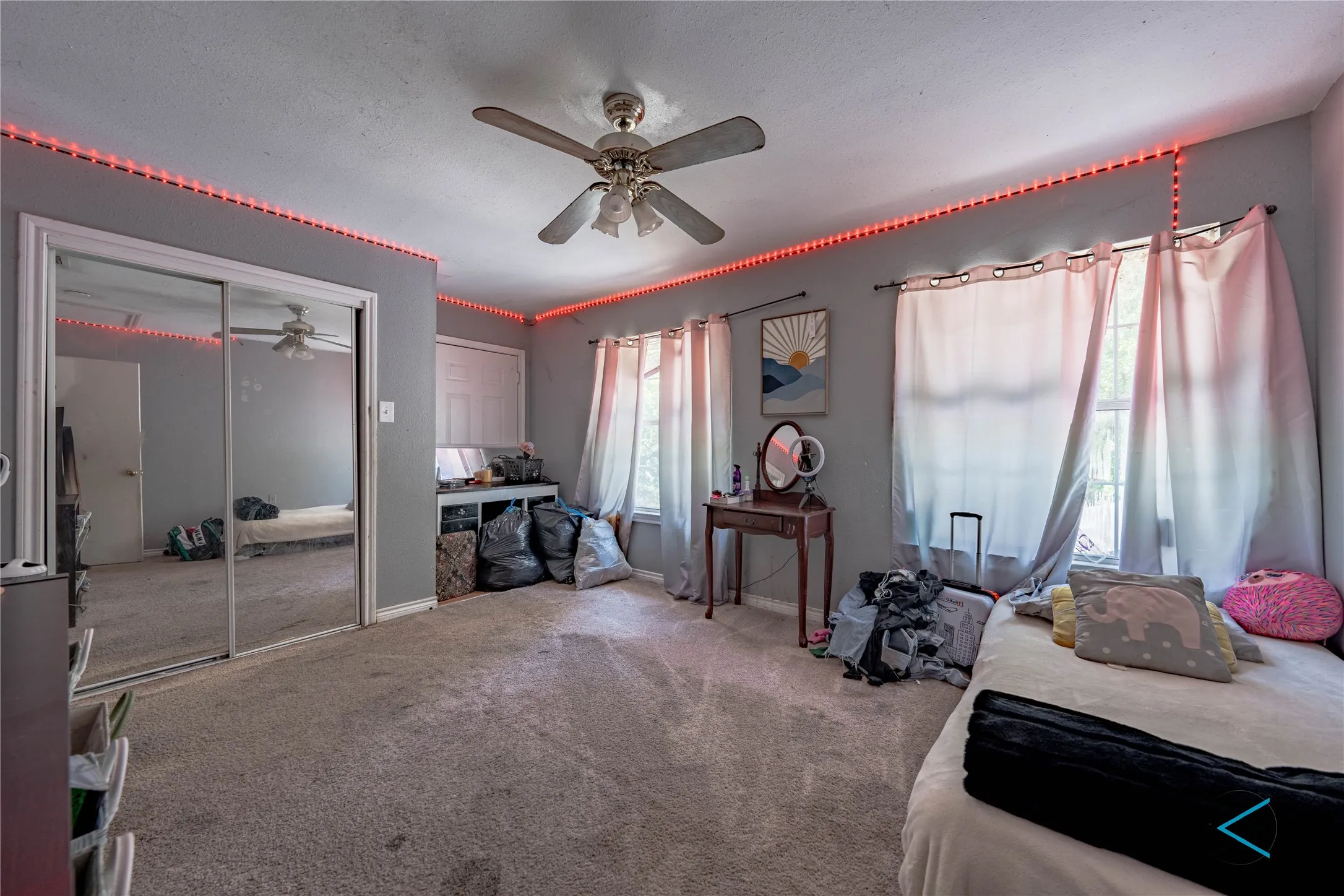 Bedroom with carpet and ceiling fan