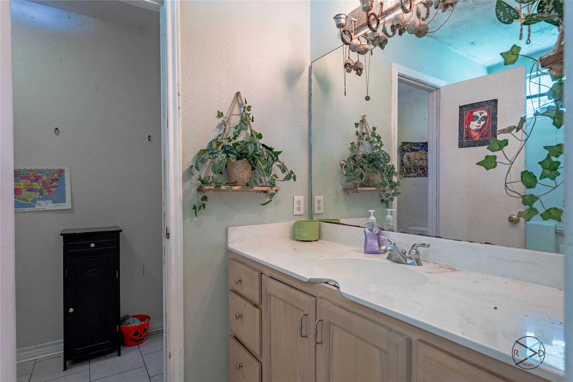 Bathroom featuring vanity and tile patterned floors