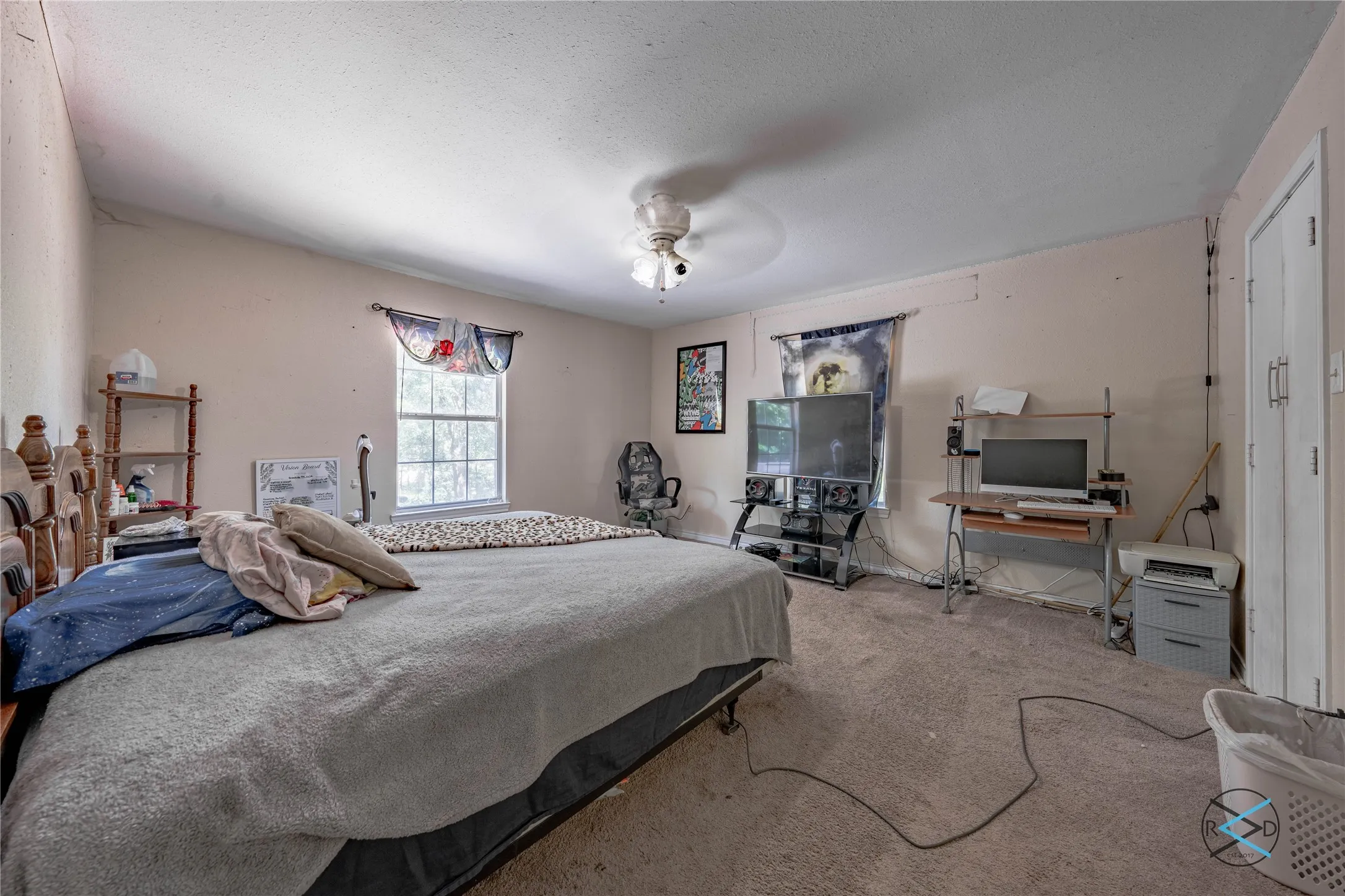 Bedroom featuring carpet floors and ceiling fan