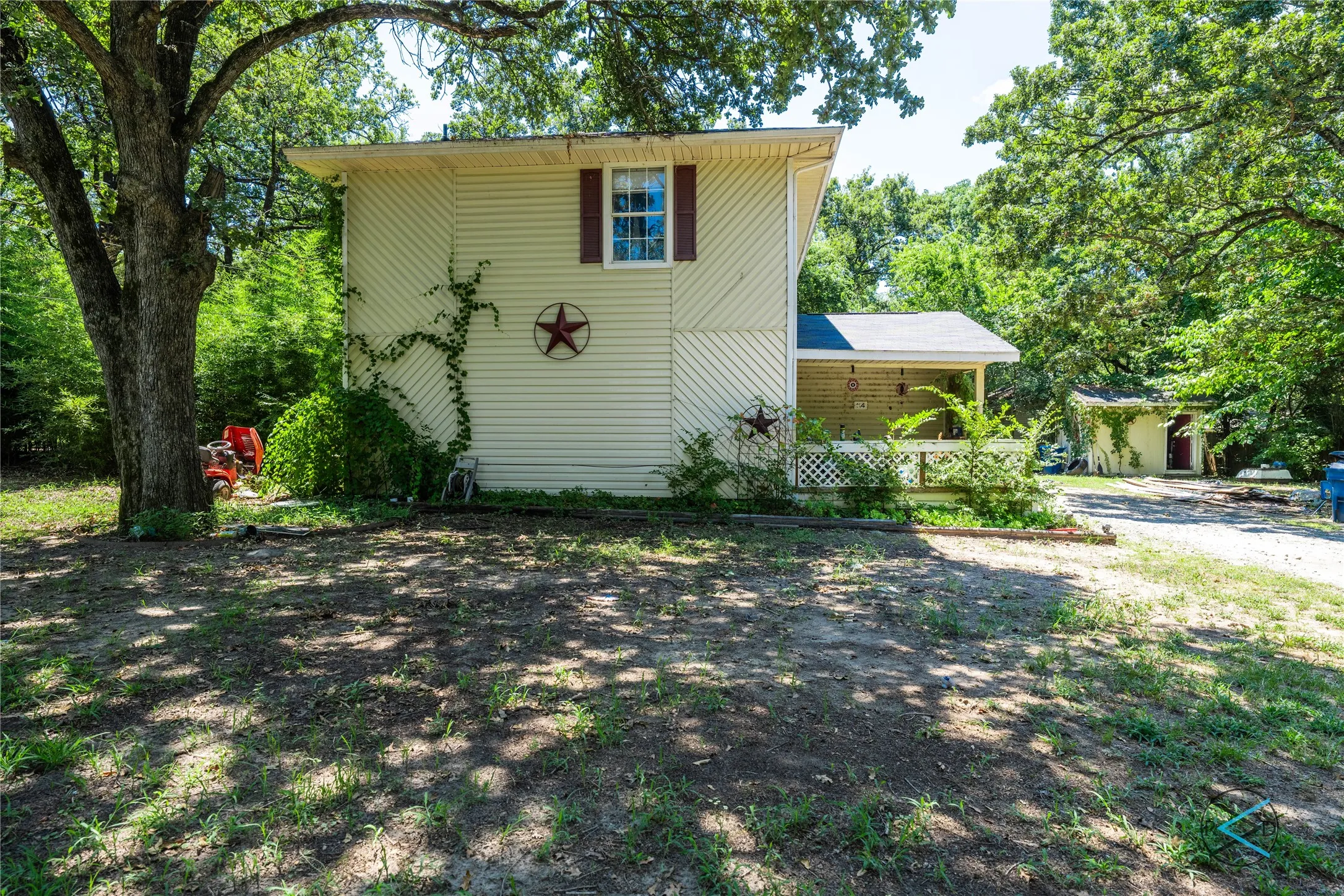 View of front of house featuring a shed