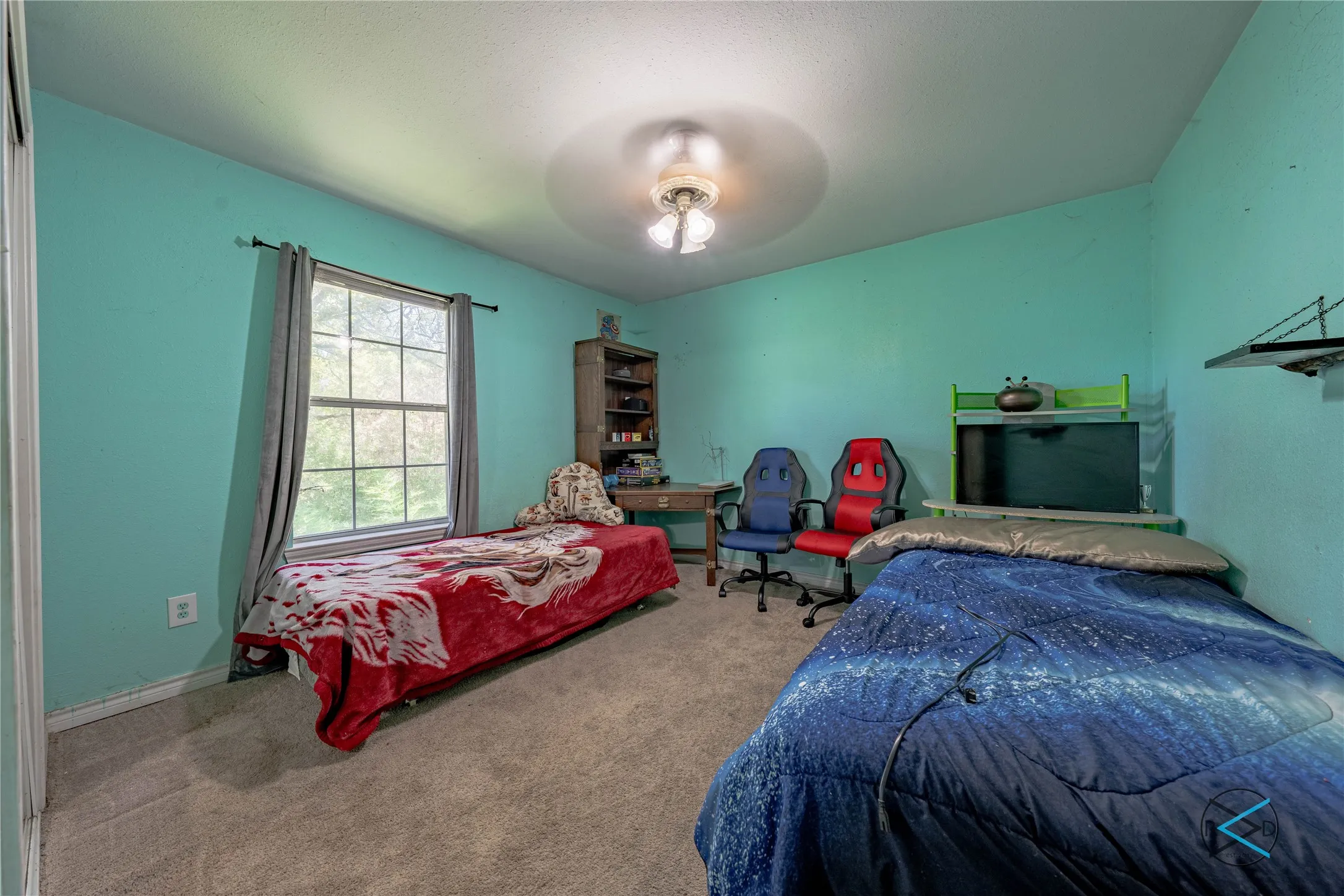 Bedroom featuring carpet and ceiling fan