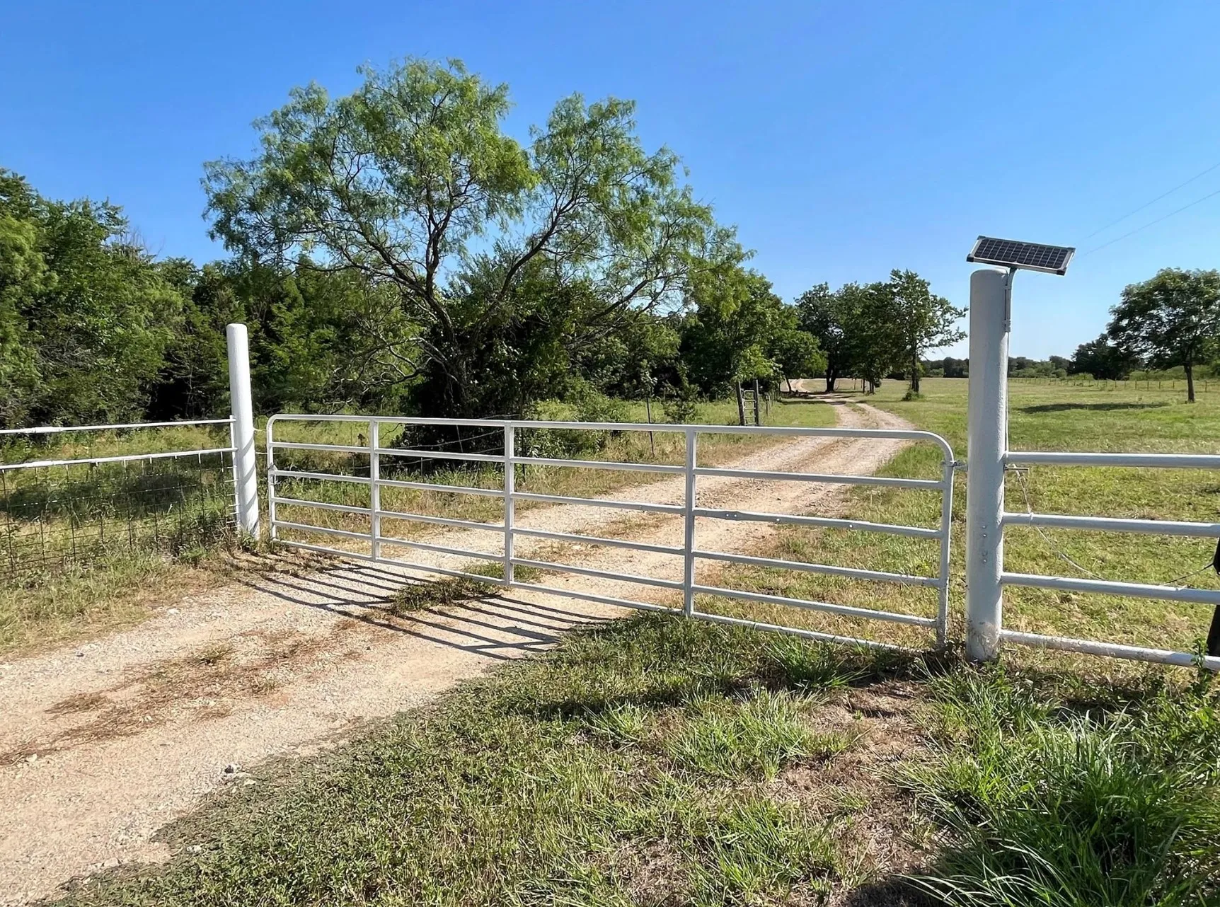 View of gate with a yard