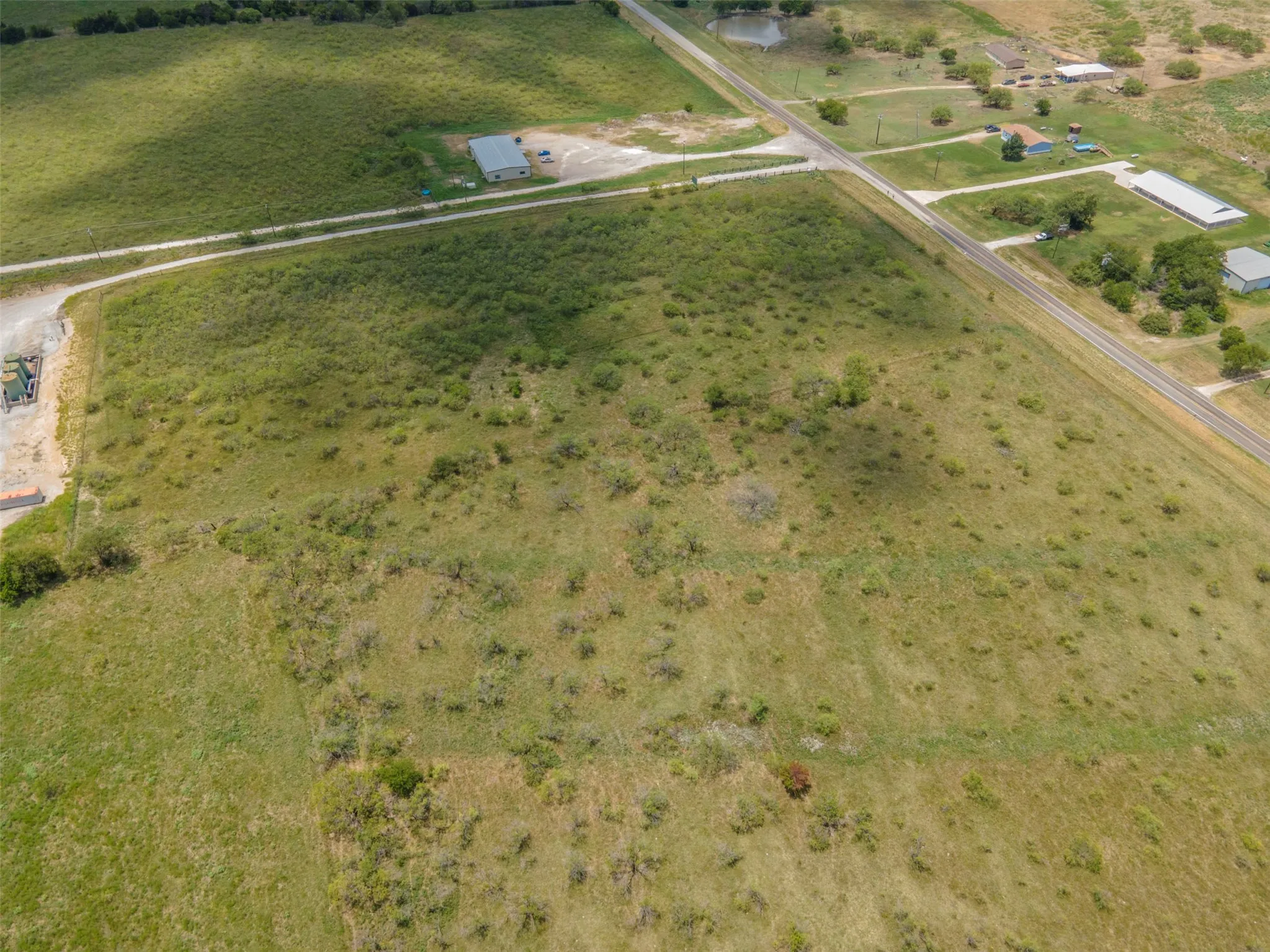Birds eye view of property with a rural view