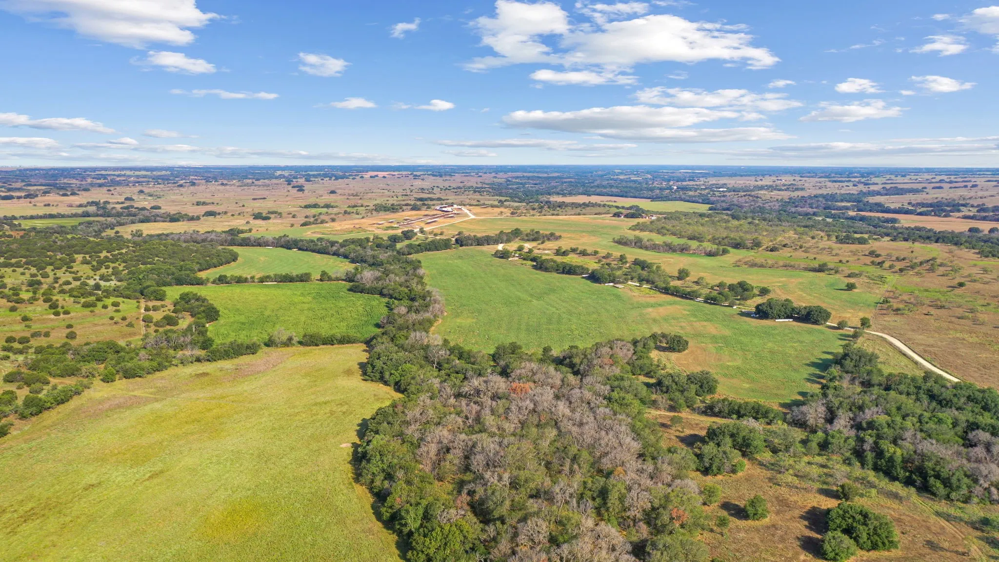 Birds eye view of property with a rural view