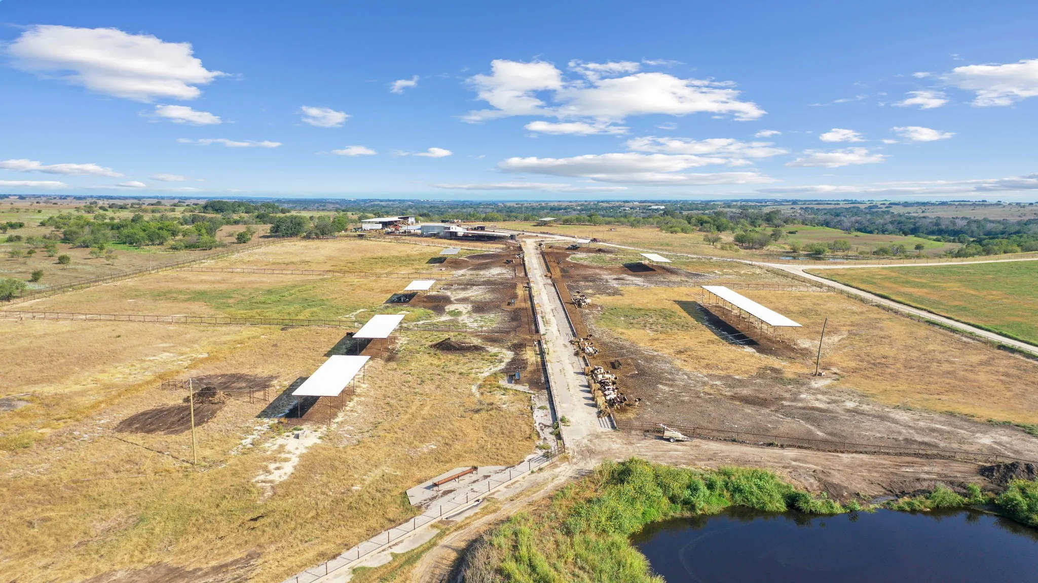 Drone / aerial view with a water view and a rural view