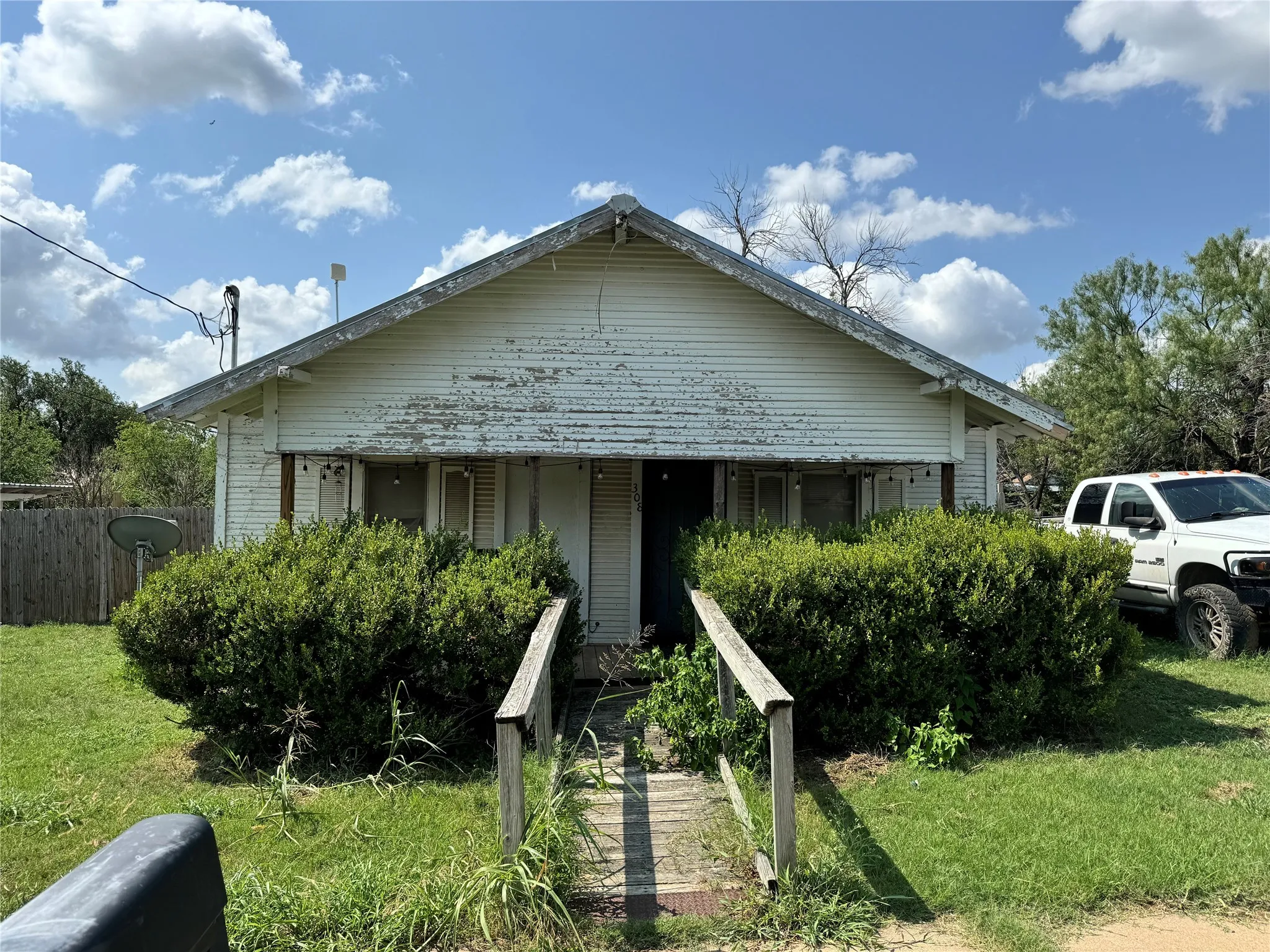 Bungalow-style house with a front yard