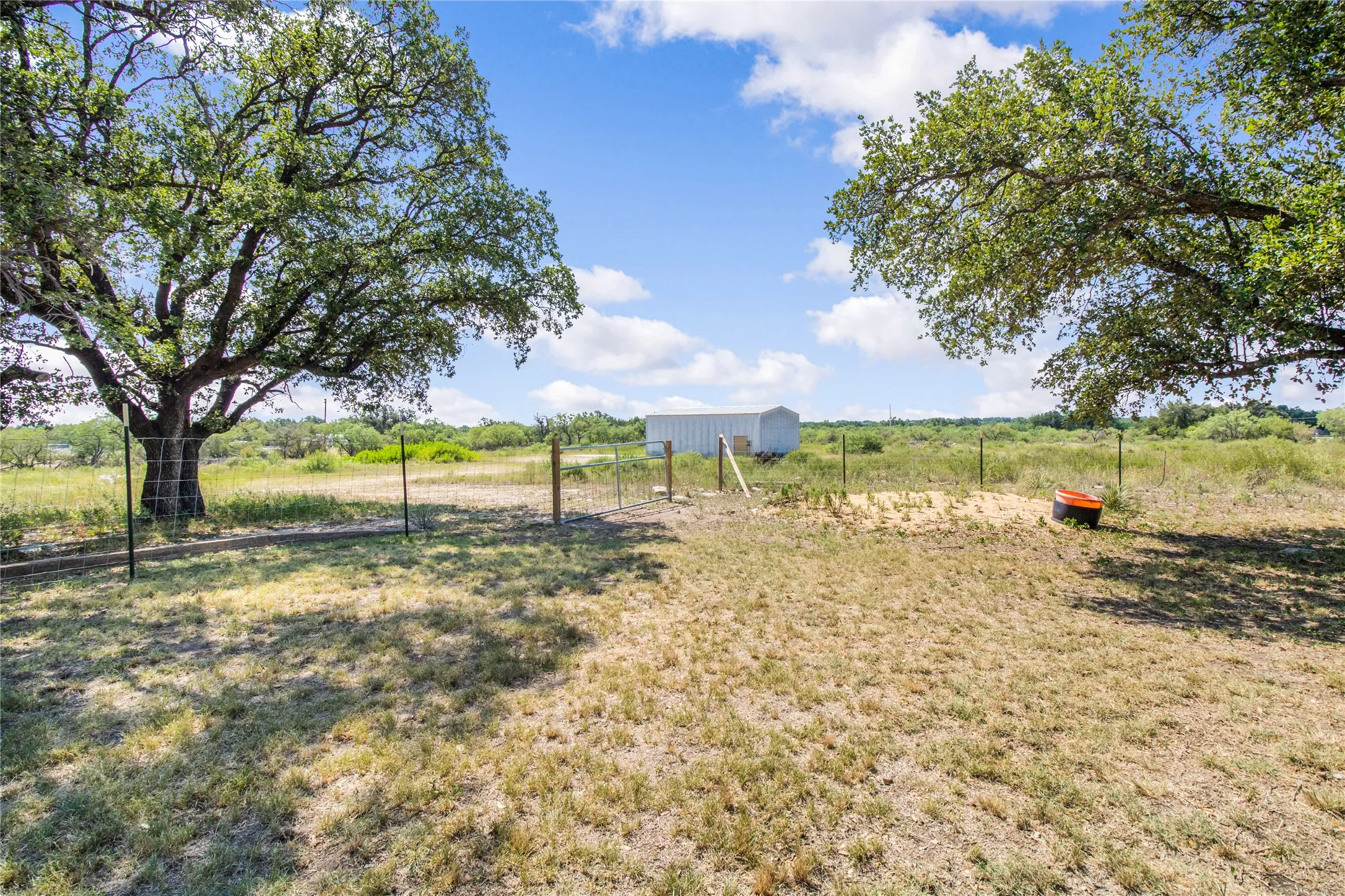 View of yard with a rural view